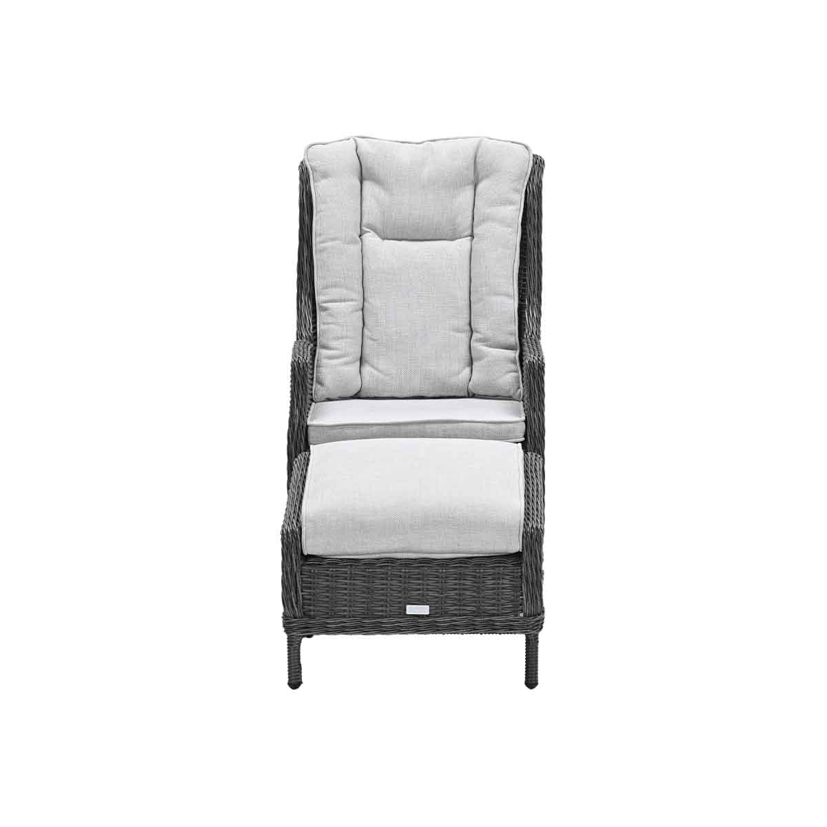 Rattan chair with footrest, gray cushions. Dark gray rattan. White background.