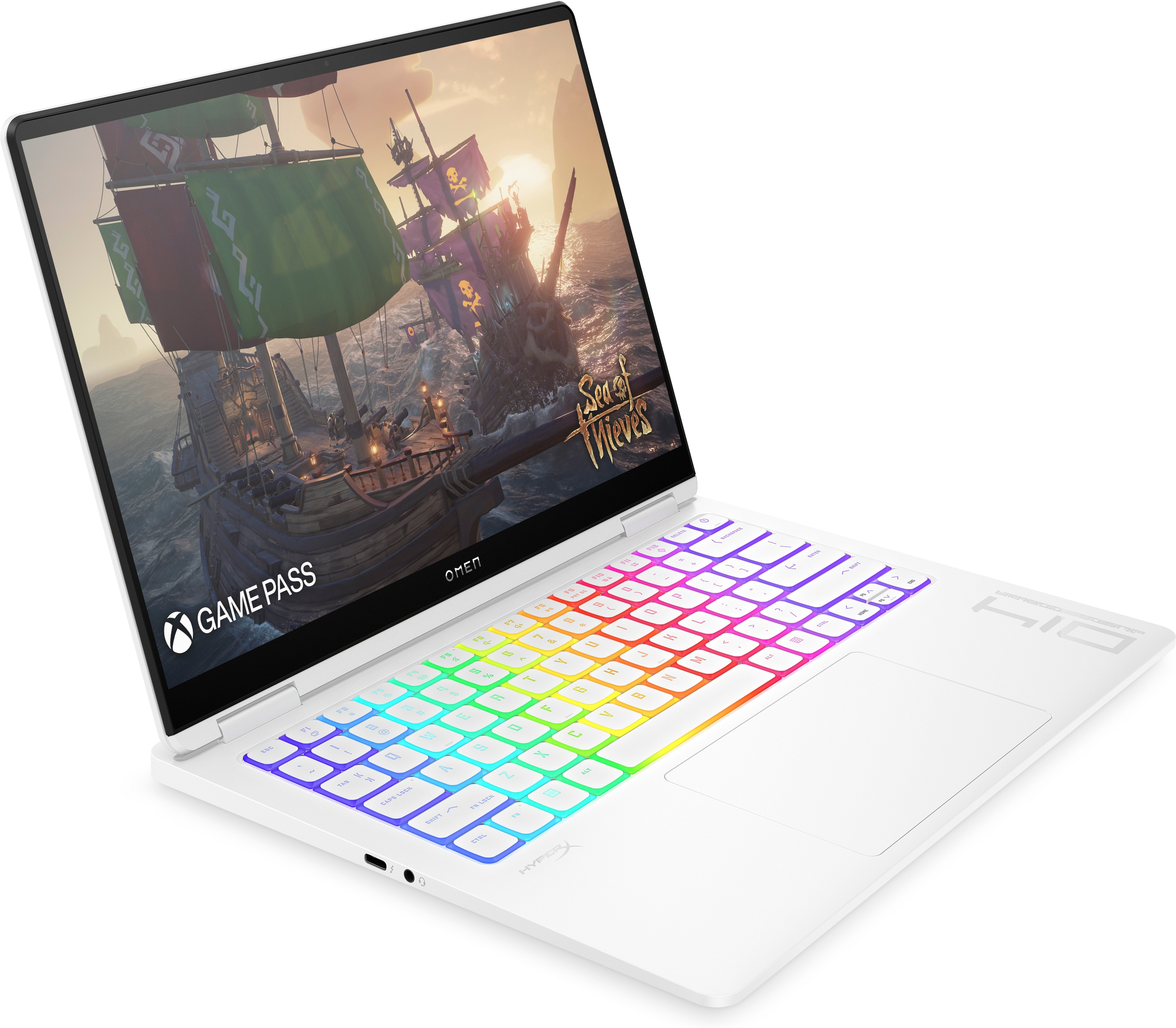 Portátil Omen blanco con pantalla abierta mostrando un juego, teclado arcoíris y superficie blanca.
