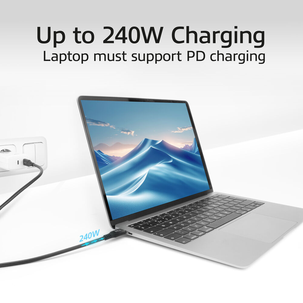 Laptop ładujący się czarnym kablem. Ekran pokazuje niebieską scenę. Tekst: Do 240W ładowania.