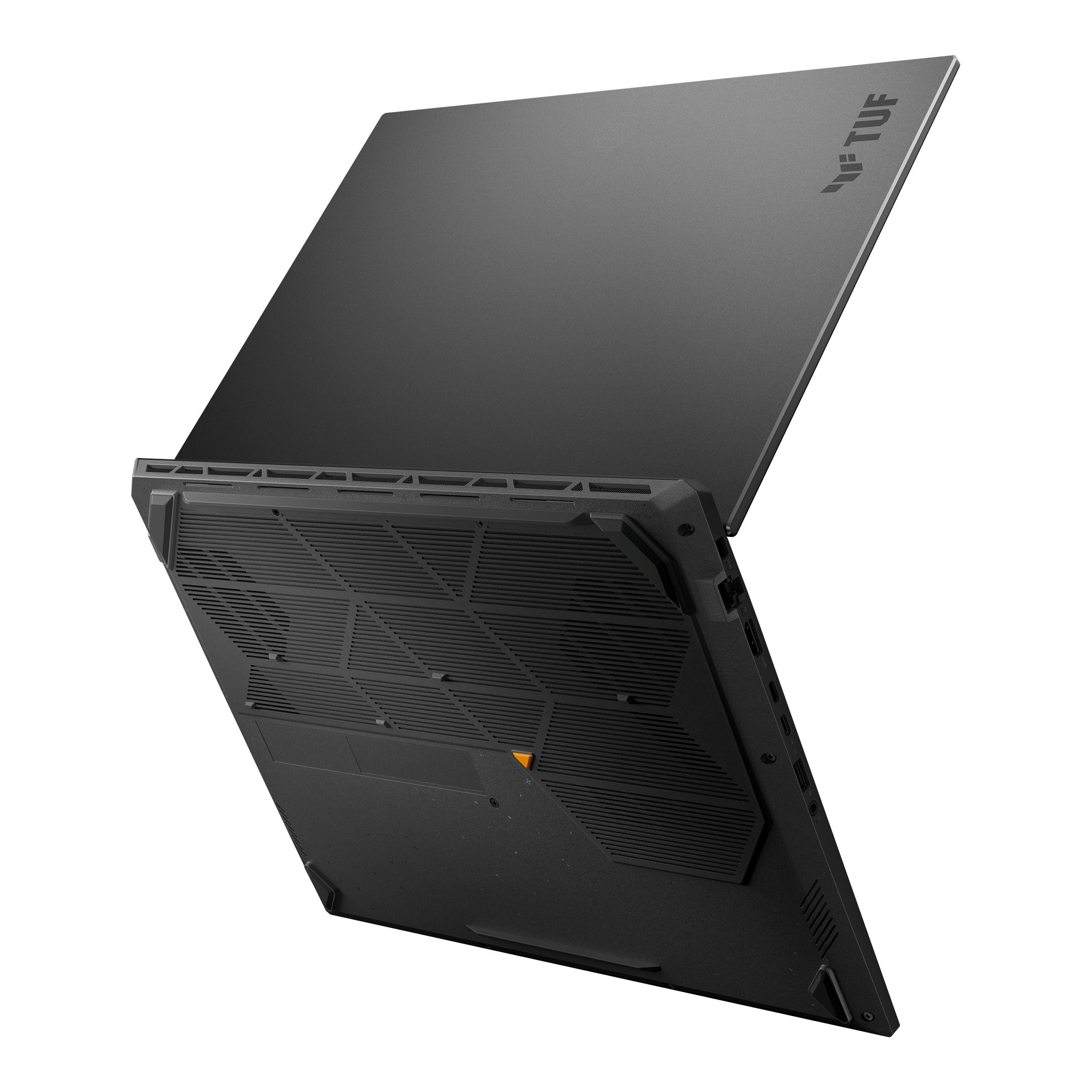 Black laptop, underside view. The vents and a yellow label are visible. The laptop is slightly open.