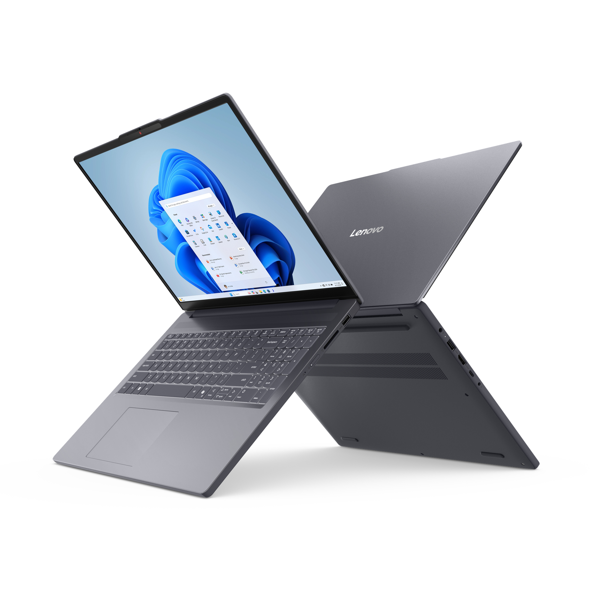 Dwa ciemnoszare laptopy Lenovo, jeden otwarty, wyświetlający pulpit Windows 11. Białe tło.