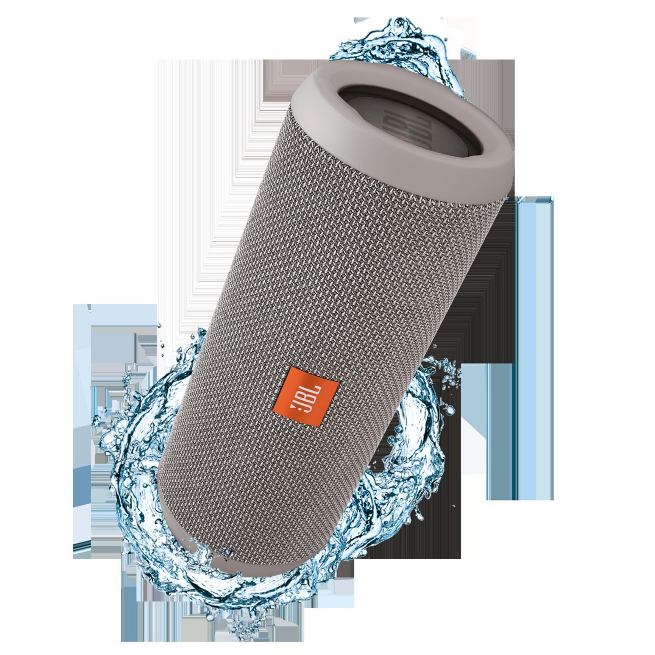 Grauer JBL-Lautsprecher mit Wasserspritzeffekt. Der Lautsprecher ist zylindrisch.