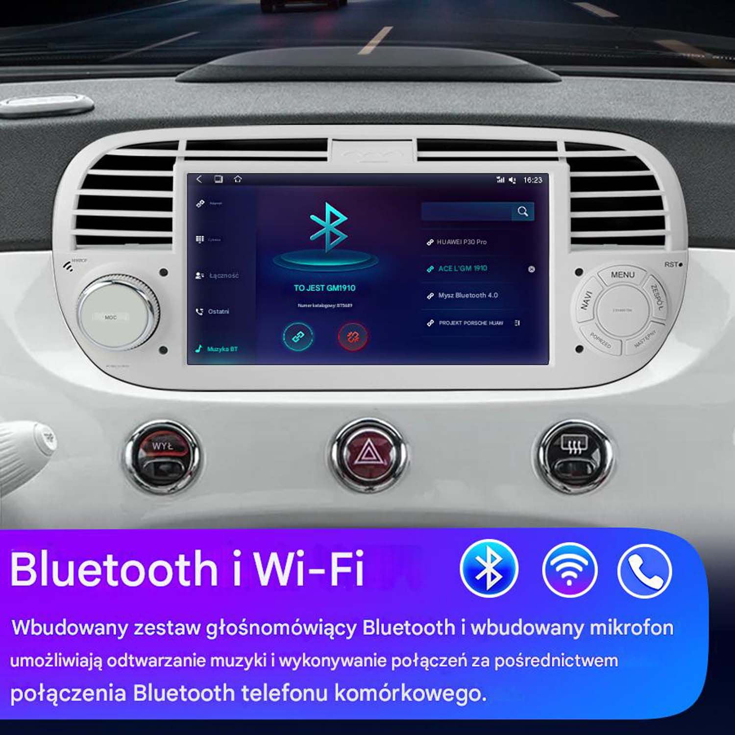 System informacyjno-rozrywkowy samochodu z ekranem wyświetlającym opcje menu. Widoczna kierownica i deska rozdzielcza.