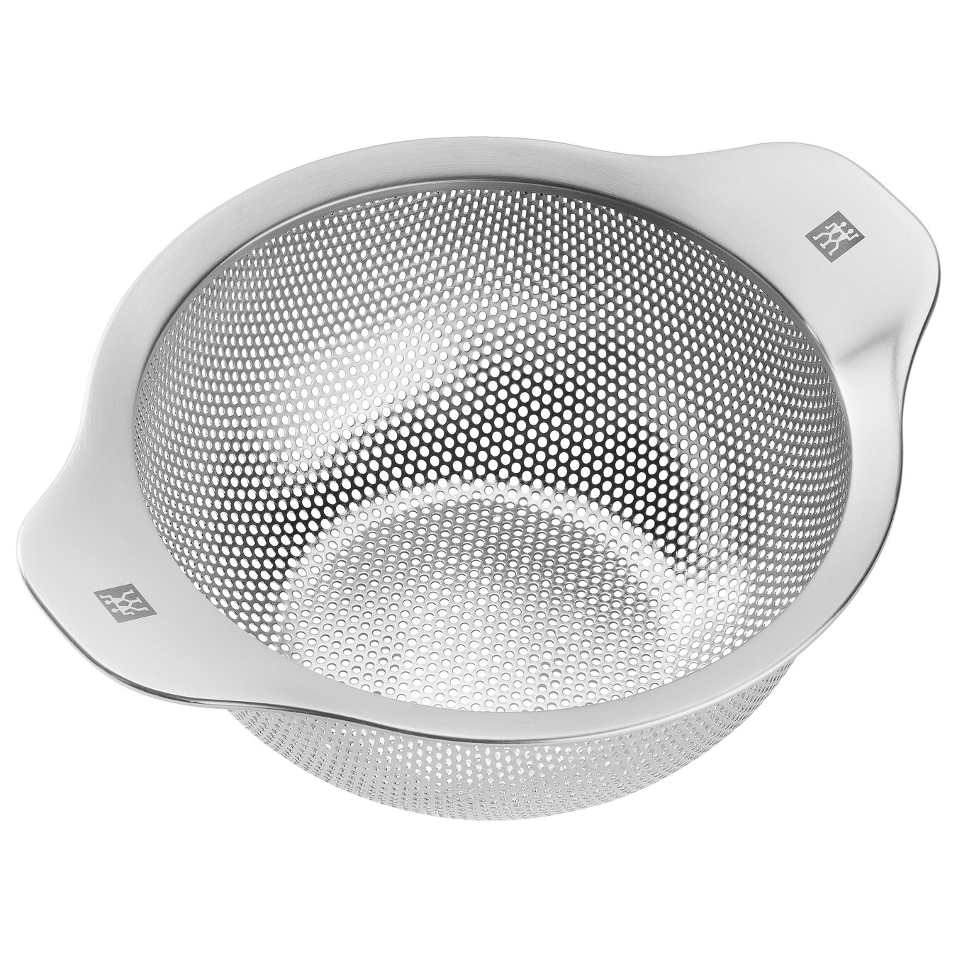 Stainless steel colander, angled view, with many small holes and handles. White background.
