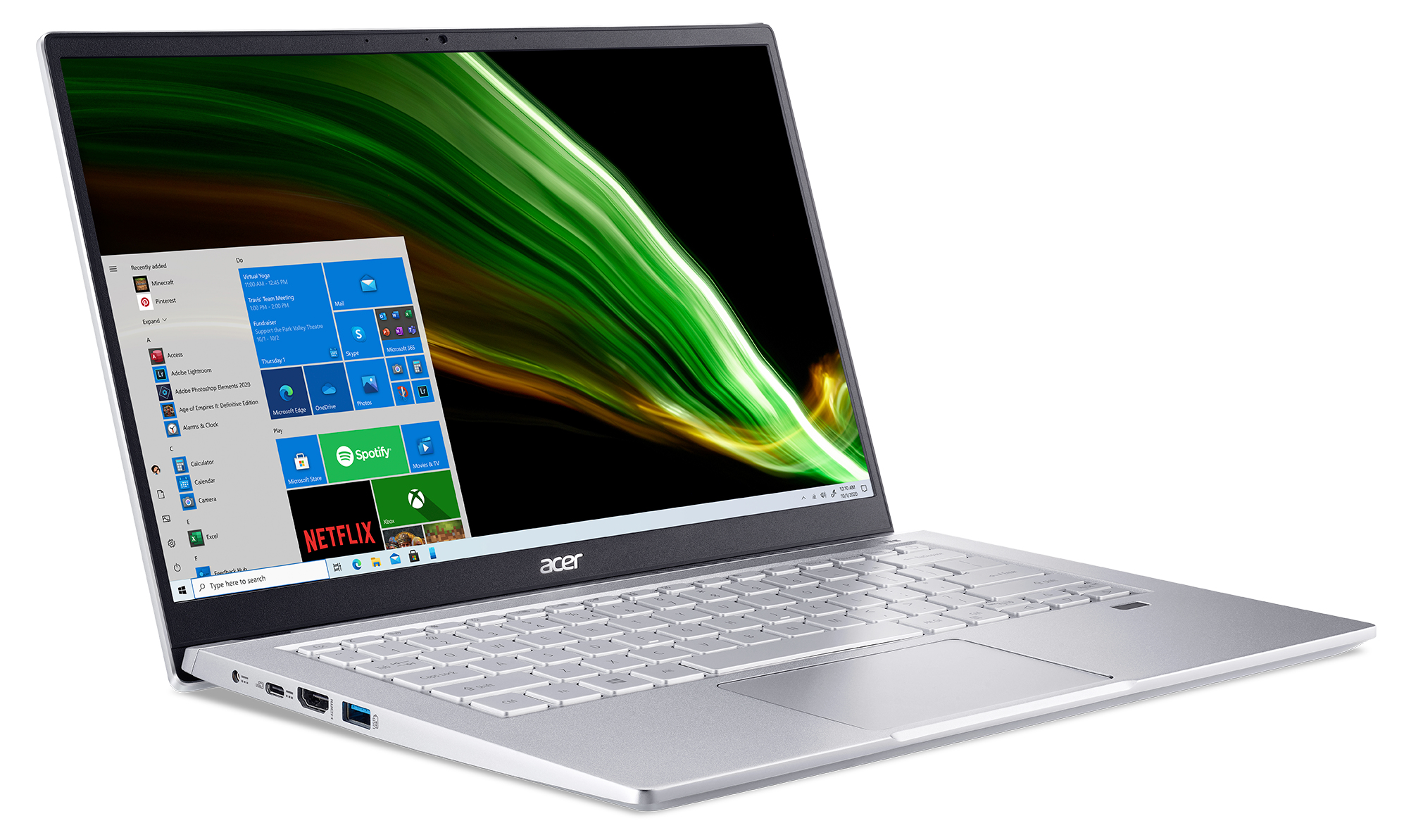 Zilveren laptop met open scherm met een Windows-interface met een groene achtergrond.