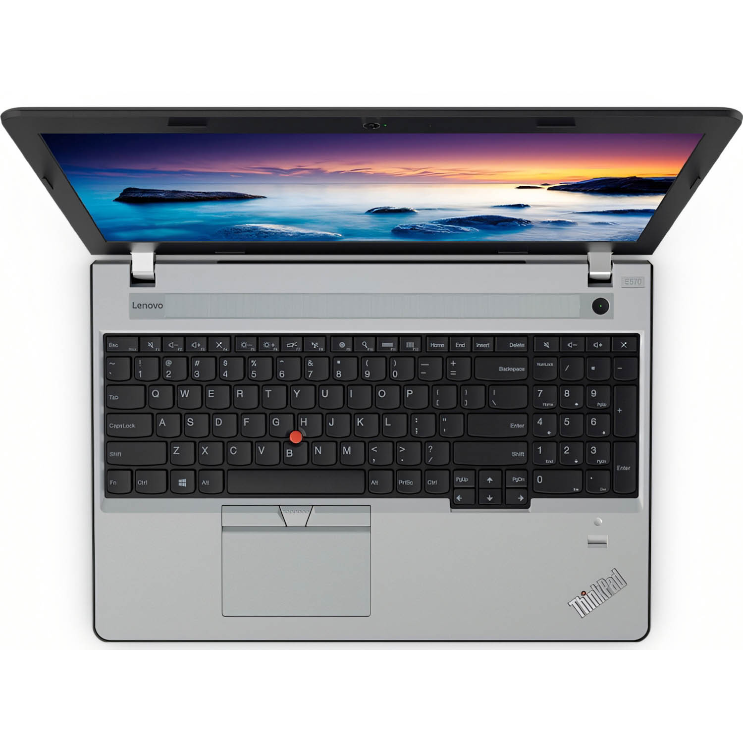 Portátil Lenovo ThinkPad plateado, abierto, mostrando el teclado y la pantalla con un paisaje.