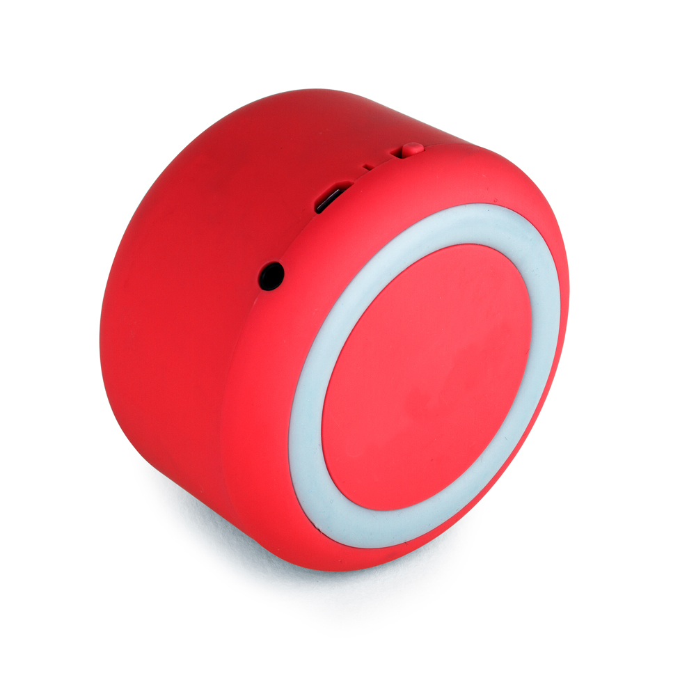 Altoparlante Veho rosso che mostra un anello azzurro su sfondo bianco.