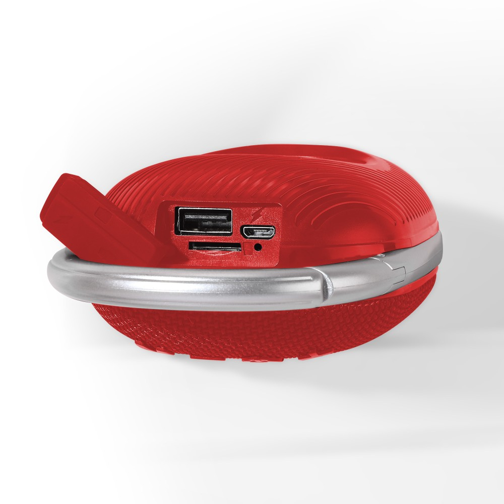Altoparlante rotondo rosso con porte. Un anello argentato circonda il dispositivo. Porte: USB e scheda SD.