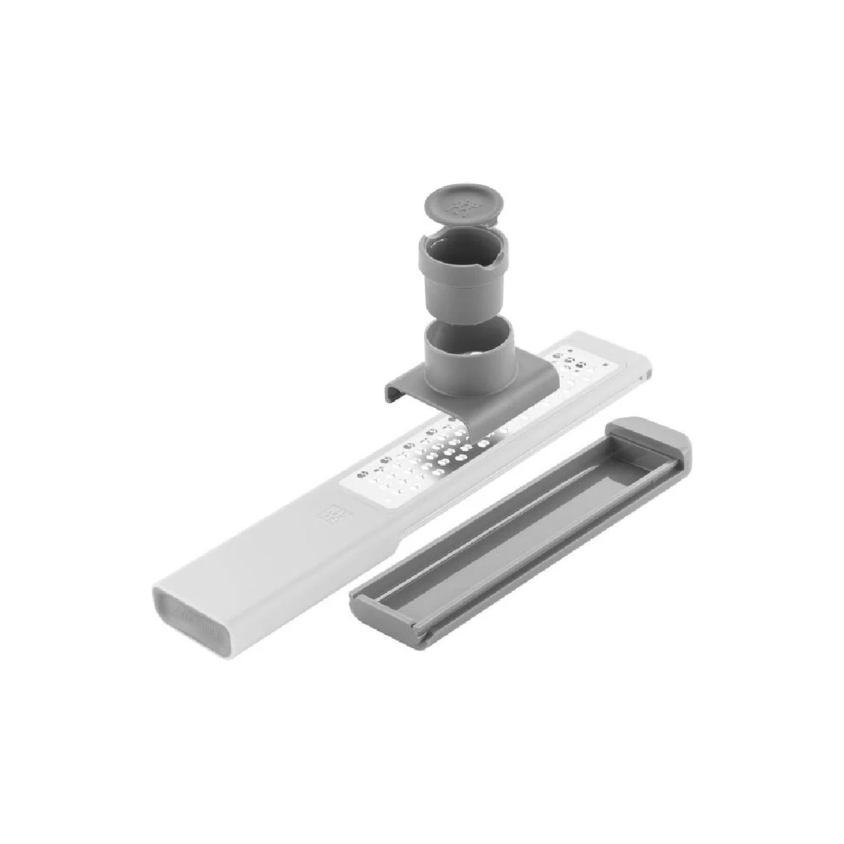 Grater with components, disassembled, on a white background.