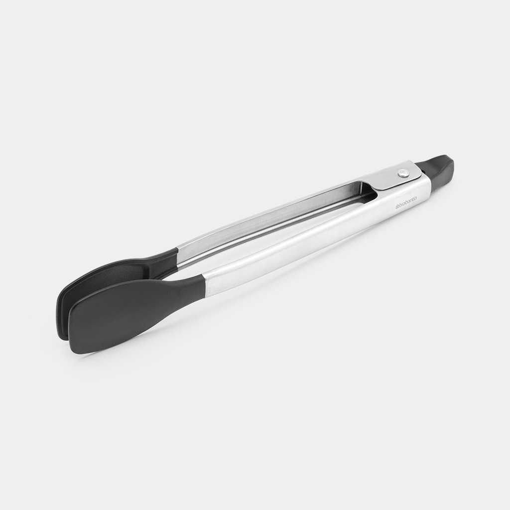 Pinze argentate con punte in silicone nero, su sfondo bianco.