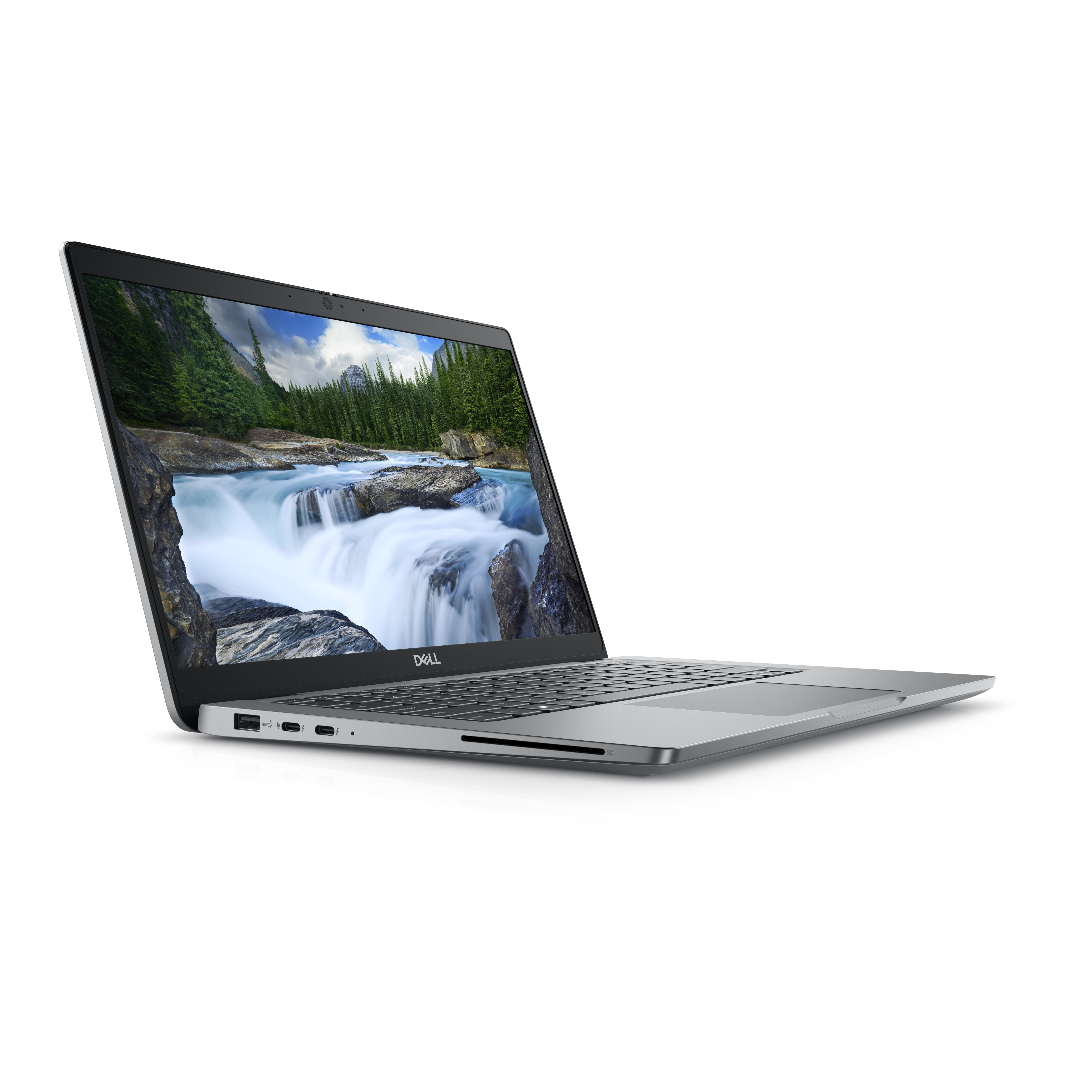Laptop Dell argento, aperto. Vista laterale con cascata sullo sfondo. Bianco.