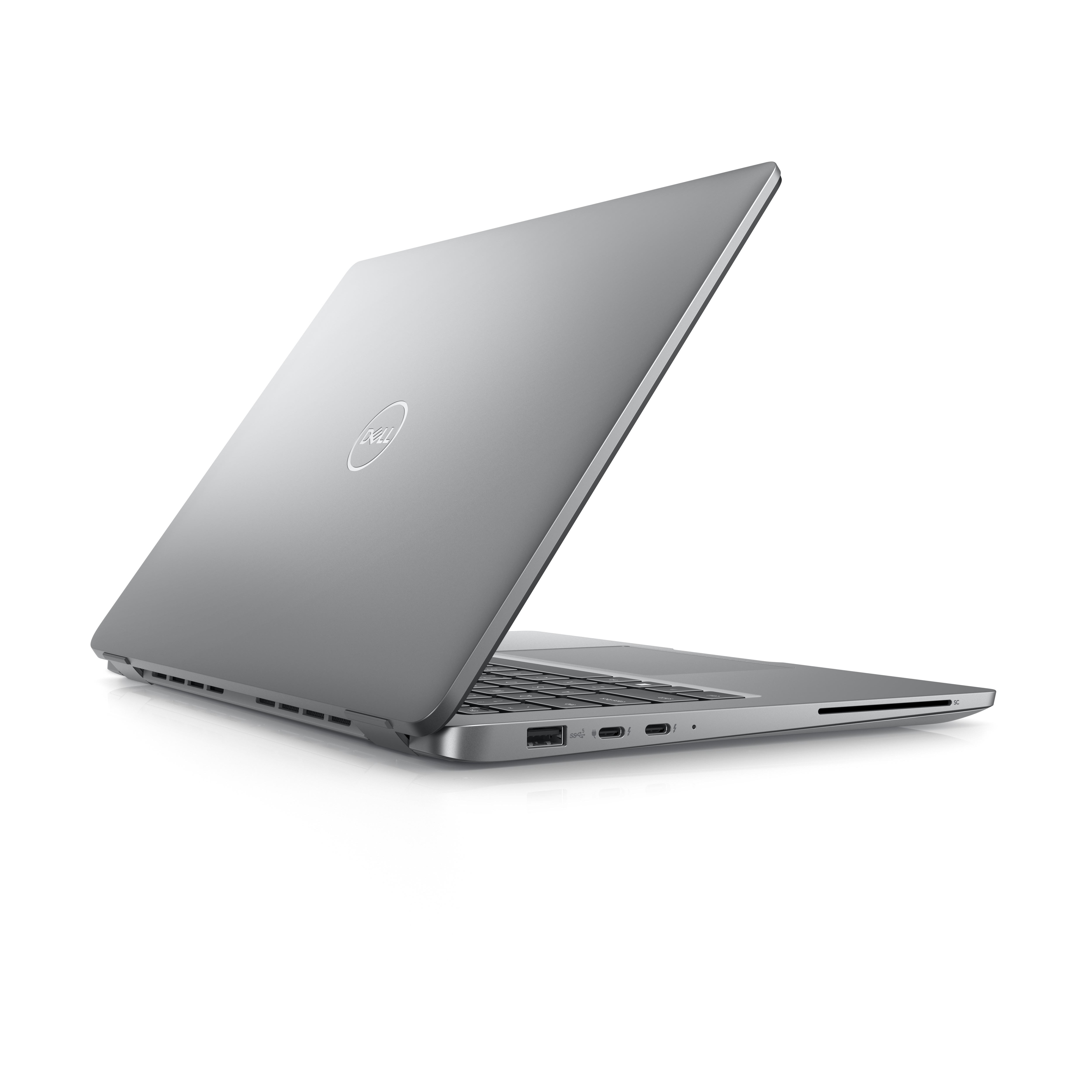 Laptop Dell argentato, parzialmente aperto, mostra tastiera e schermo, su sfondo bianco.