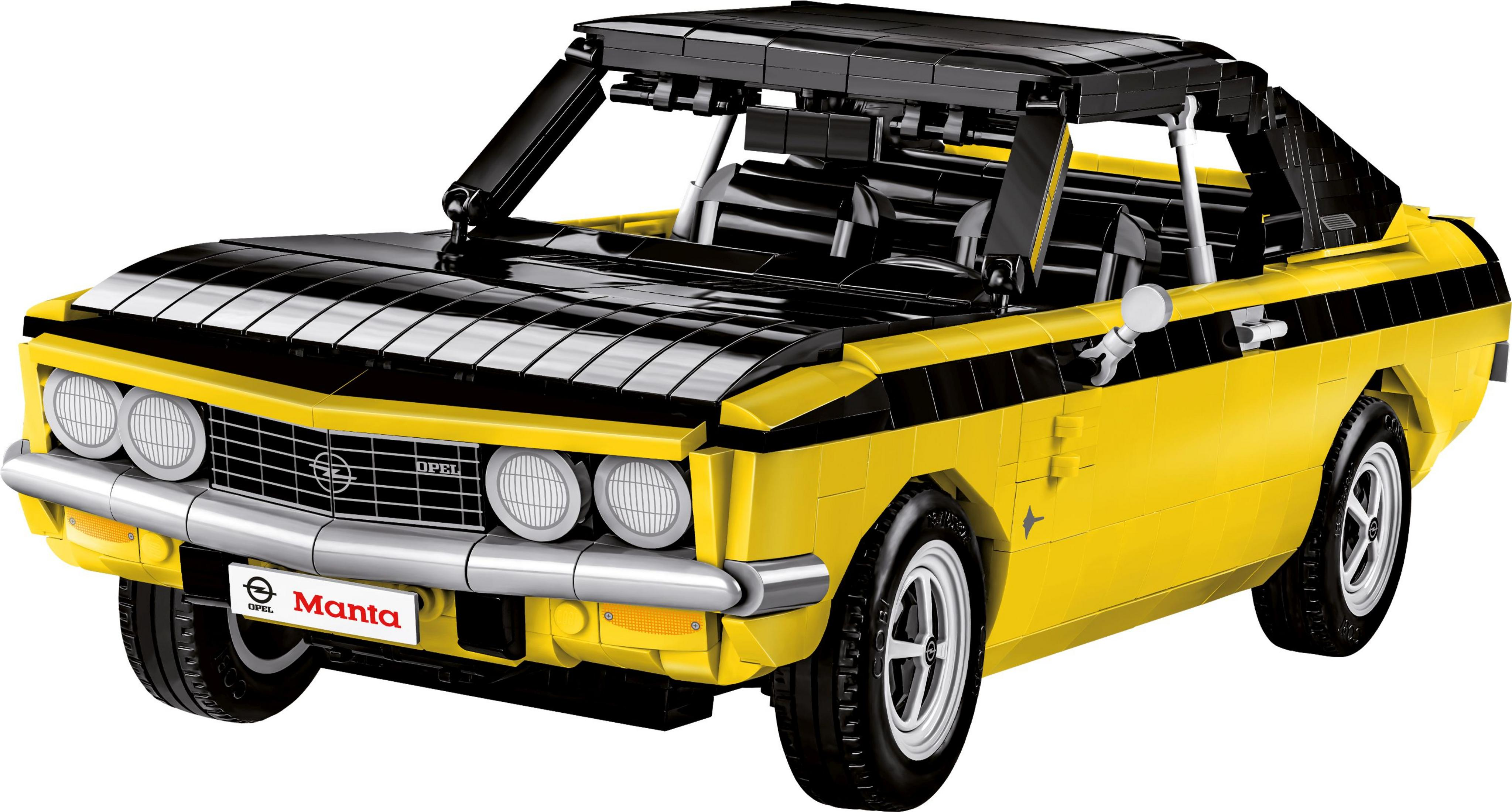 Zabawkowe auto. Żółto-czarny model samochodu, widoczny przód auta. Logo Opla znajduje się z przodu.