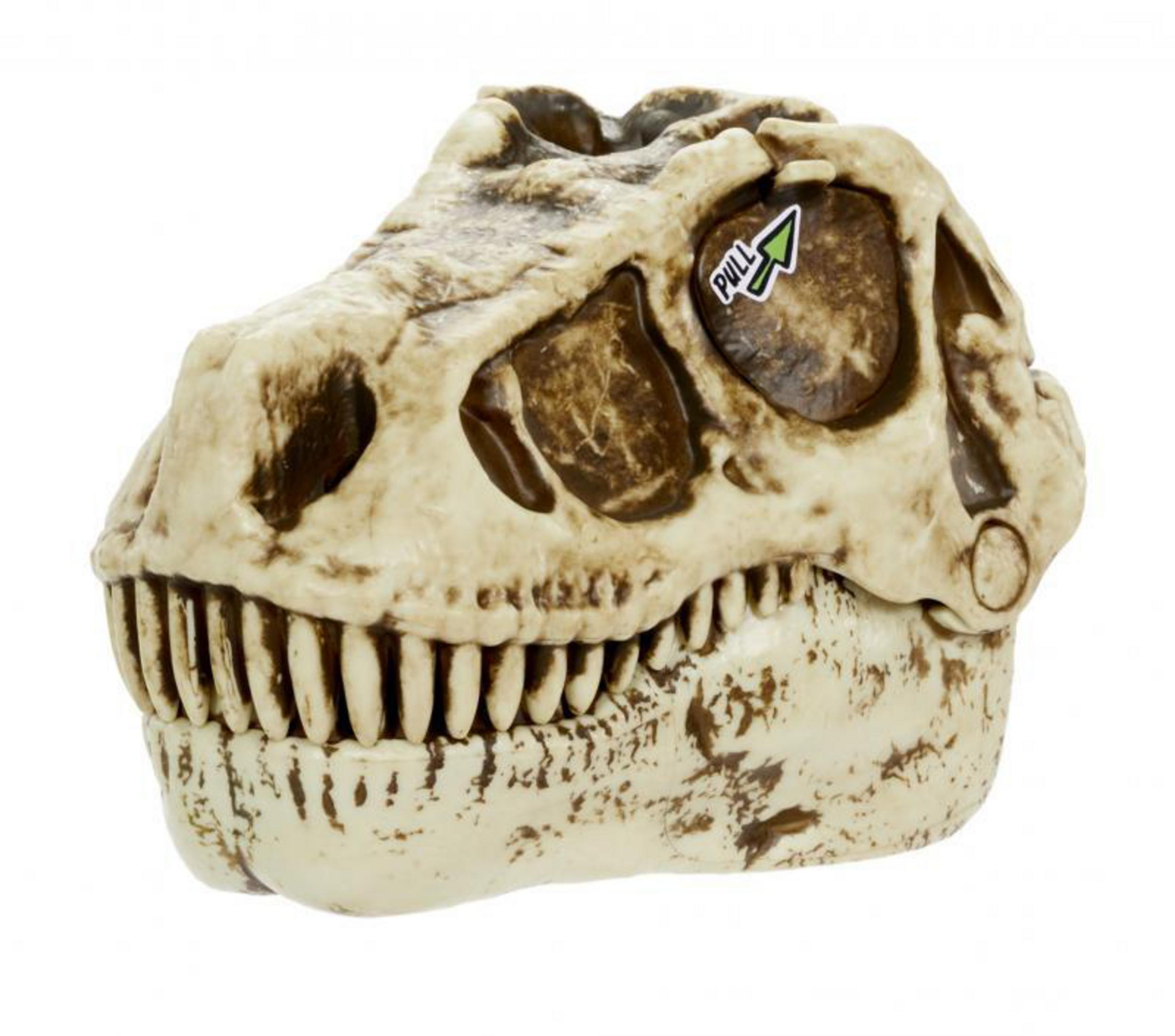 Cráneo de dinosaurio de juguete. Una flecha que apunta a "PULL" es visible en la parte superior.
