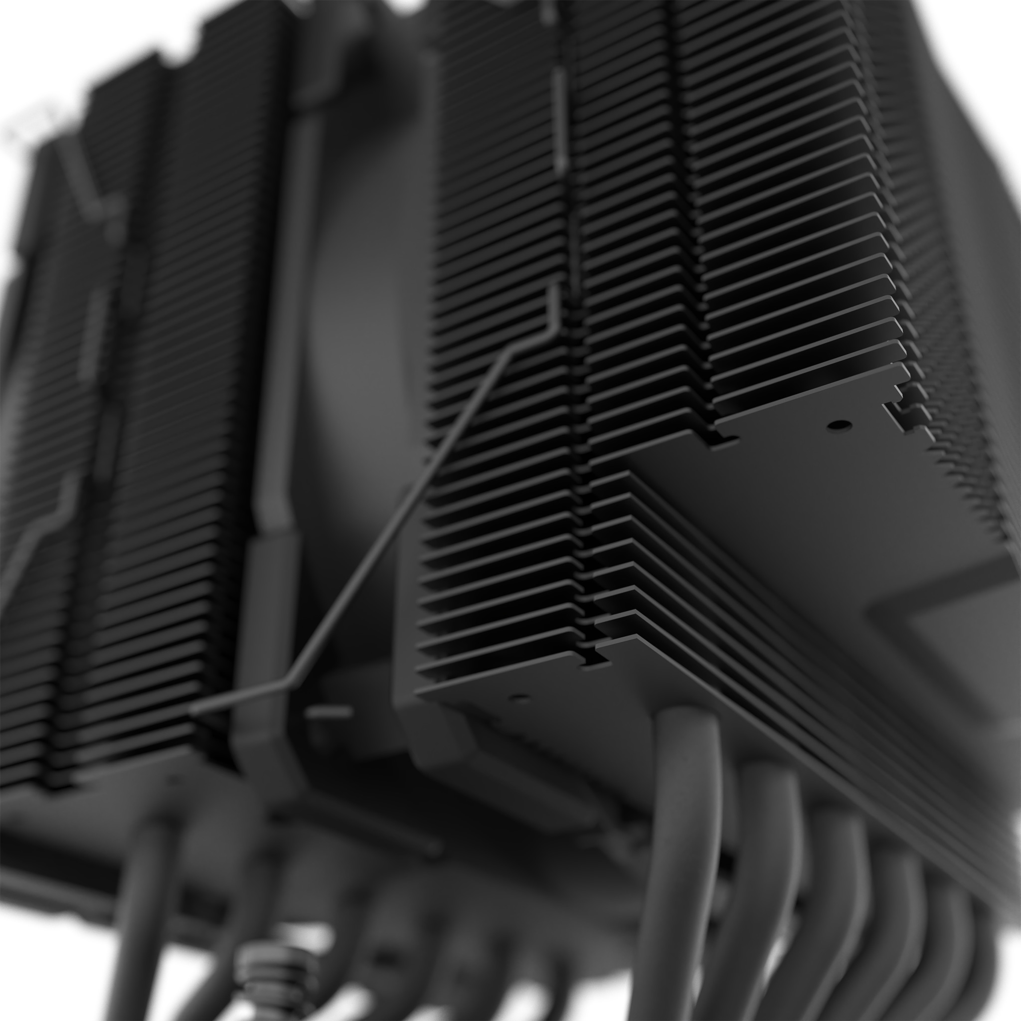 Close-up view of a black CPU cooler. Shows rows of fins and connecting tubes.