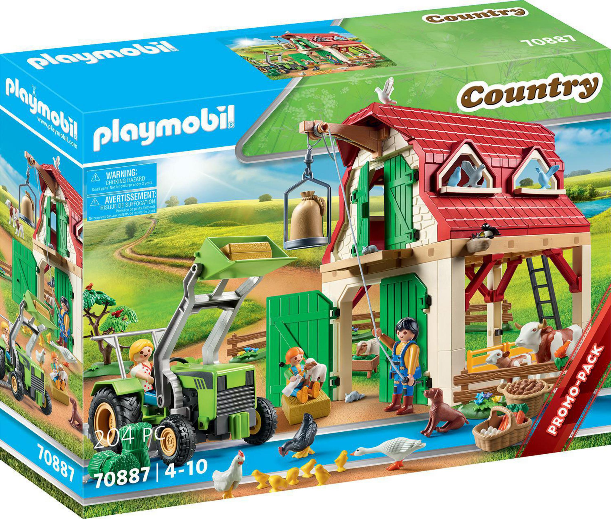 Pudełko z zestawem farmy Playmobil z traktorem, zwierzętami i figurkami. Zielone pola.