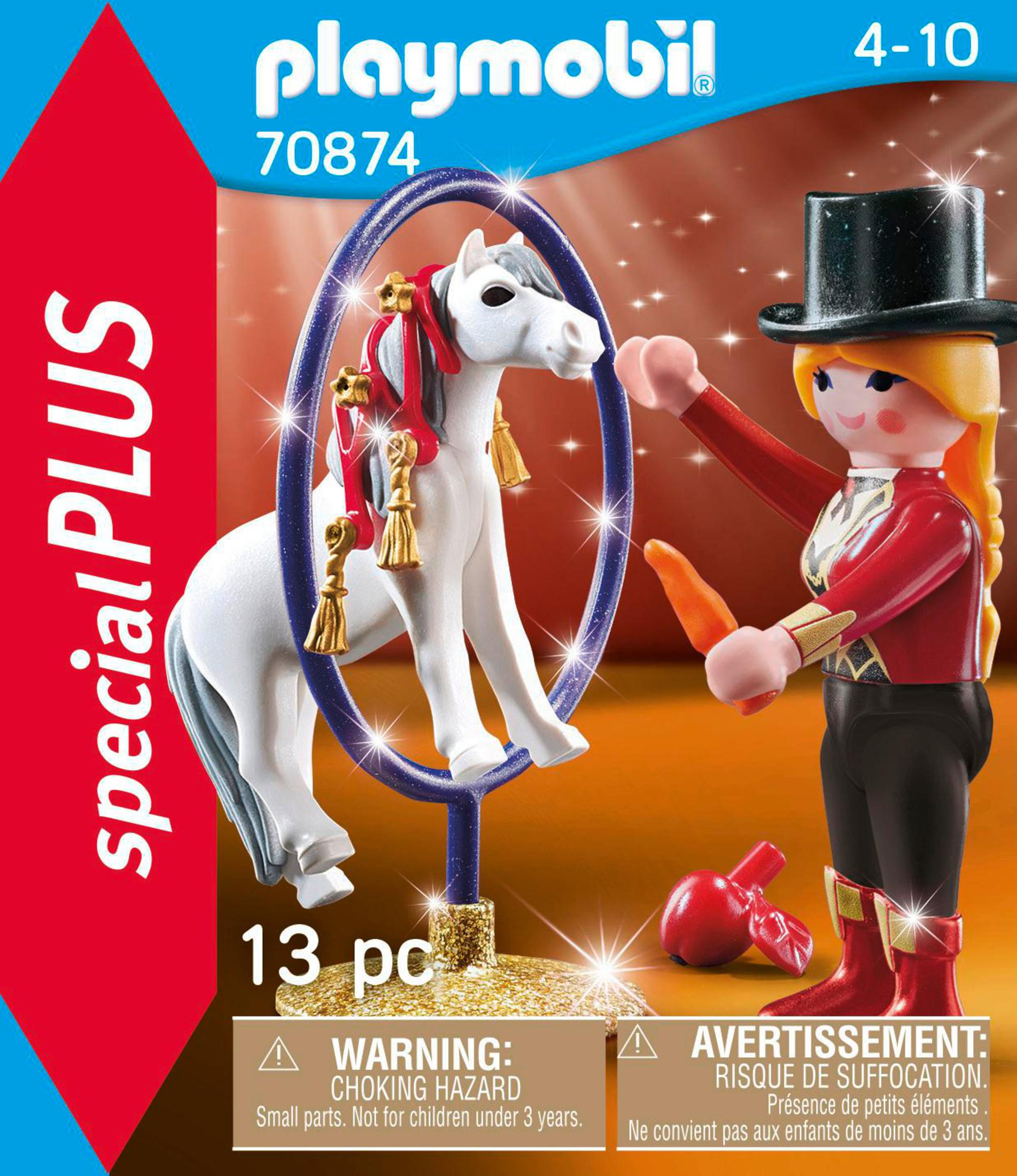 Zestaw cyrkowy Playmobil z białym koniem skaczącym przez obręcz, kobieta z marchewką.