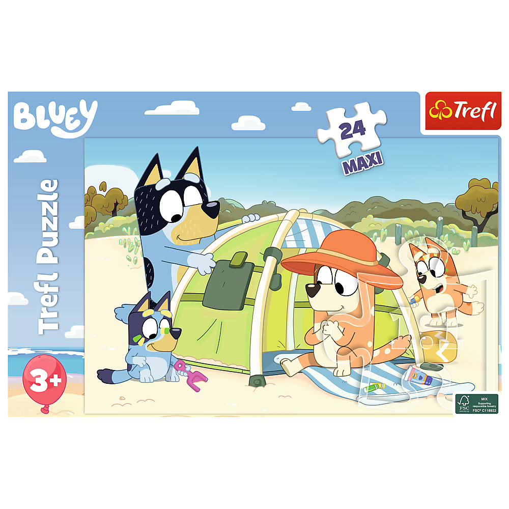 Puzzle Bluey pokazuje Bluey i Bingo bawiących się z namiotem, z innymi postaciami na plaży.