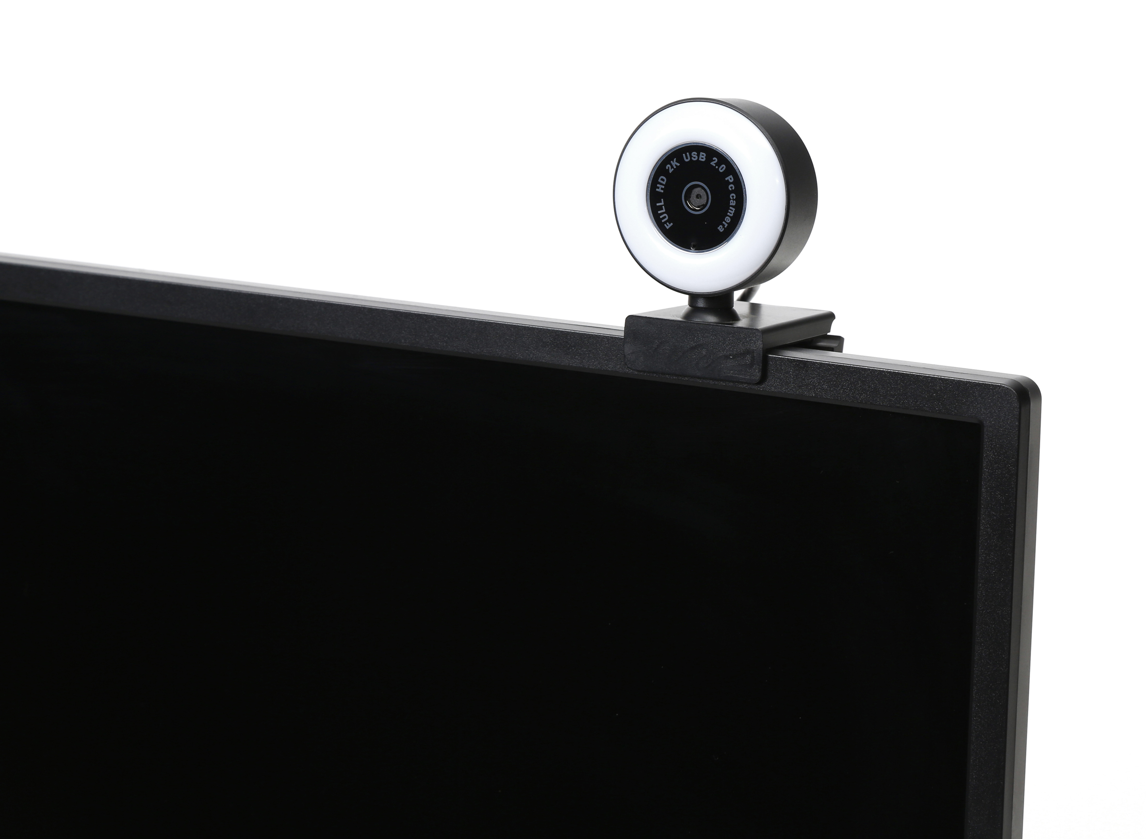 Webcam gemonteerd op een scherm. Het heeft een cirkelvormig licht en een zwarte behuizing.
