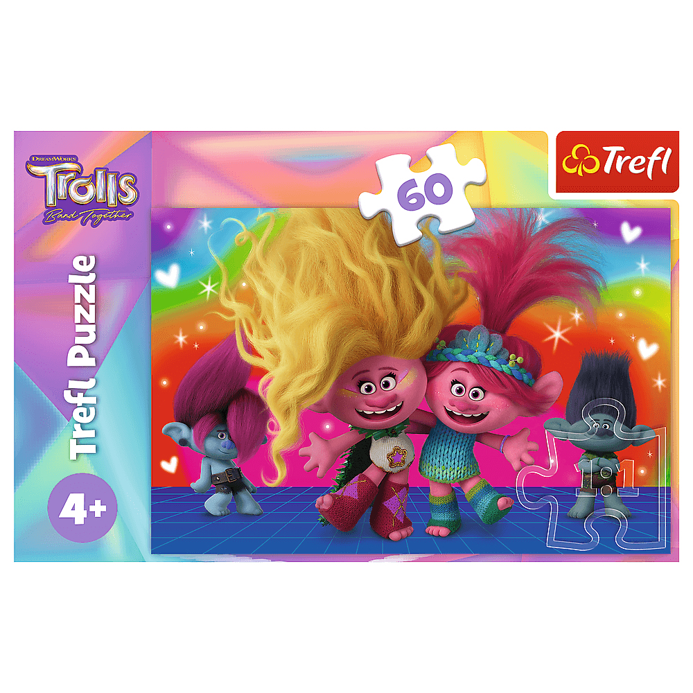A Trolls puzzle with four Trolls characters and a puzzle piece. The box has a rainbow and Trolls logo.