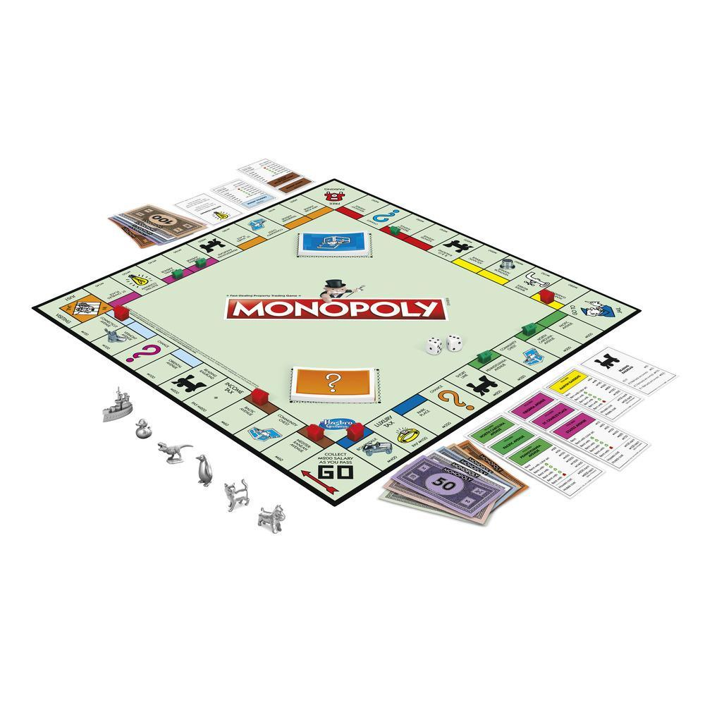 Juego de mesa Monopoly, con tablero, dinero, cartas y fichas. Dados y cubilete de dados también visibles.