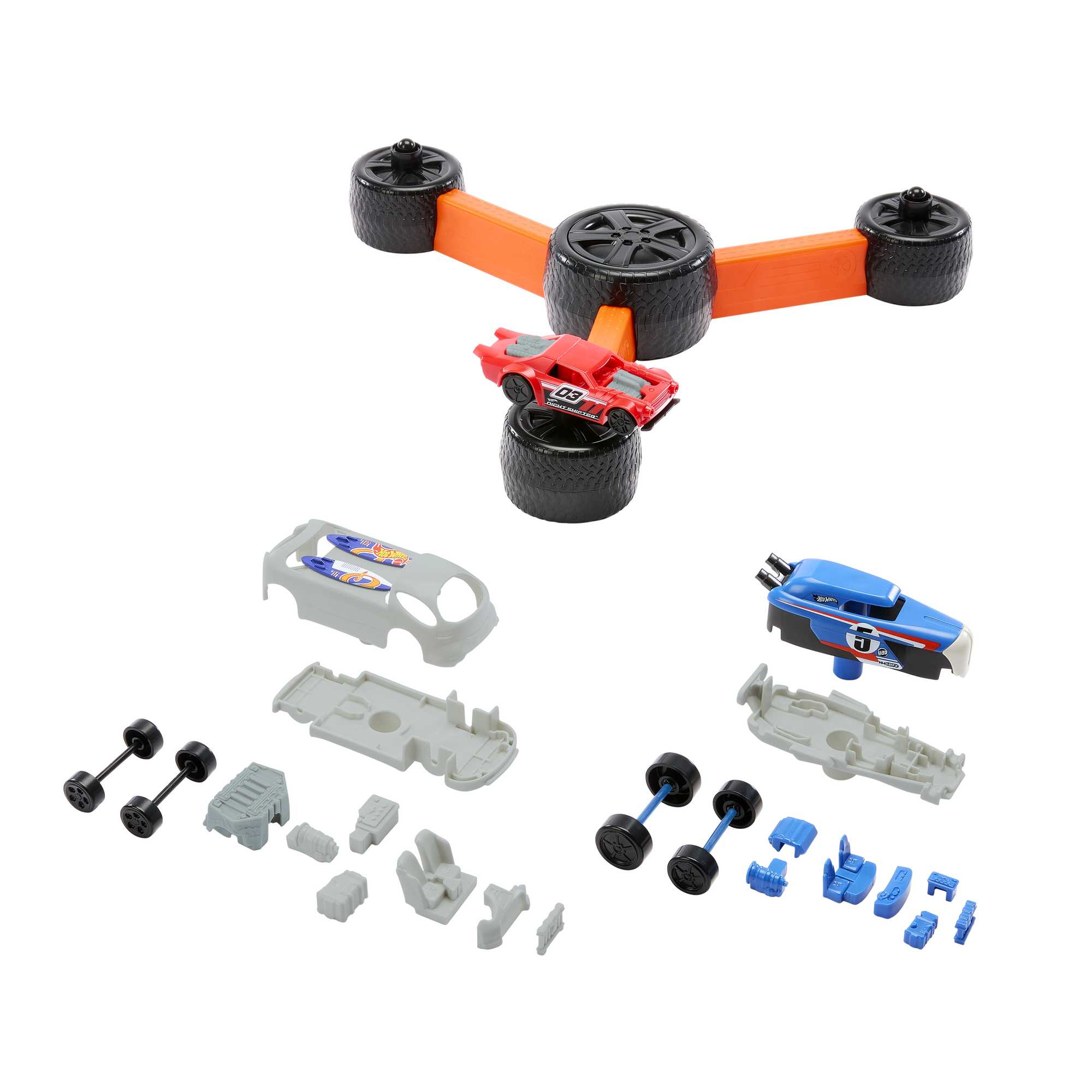 Juego de piezas de coche Hot Wheels y pista, con coche rojo montado en la pista.