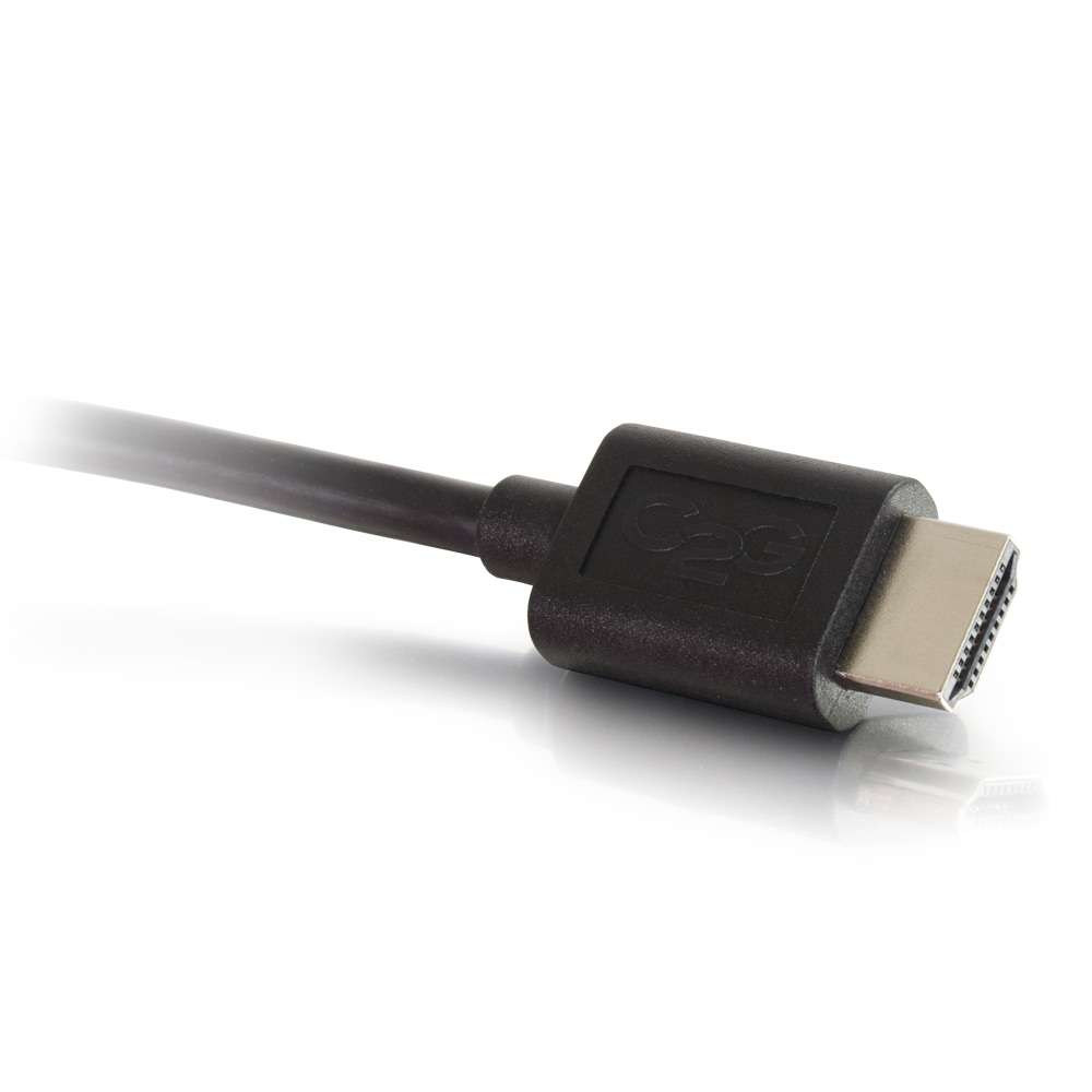 Un conector HDMI negro con un cable que se extiende hacia la izquierda, contra un fondo blanco.