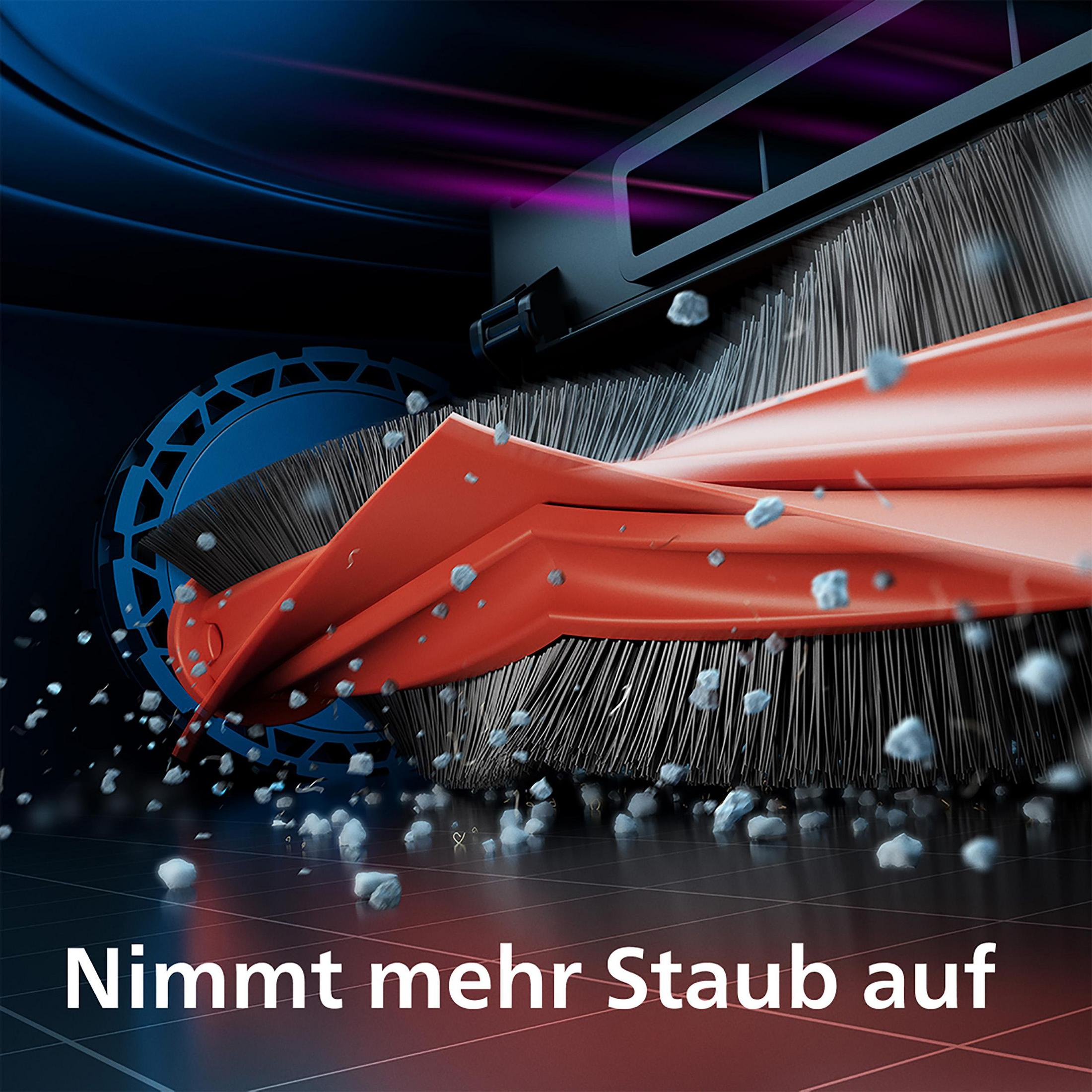 Eine orangefarbene Staubsaugerbürste in Aktion mit Staub und dunklem Hintergrund.