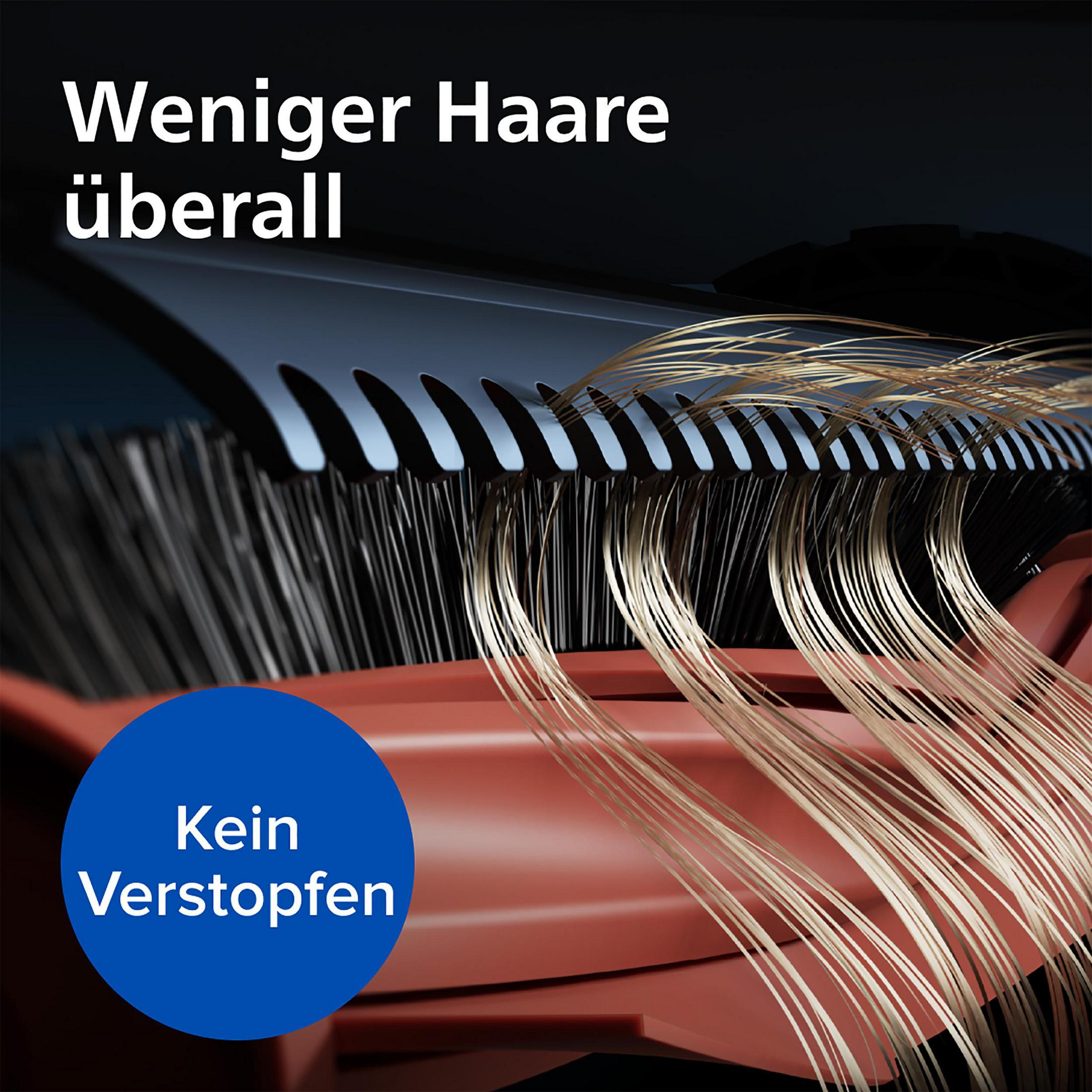Nahaufnahme einer Haarschneidemaschinenklinge mit Text. Haarsträhnen werden gezeigt.