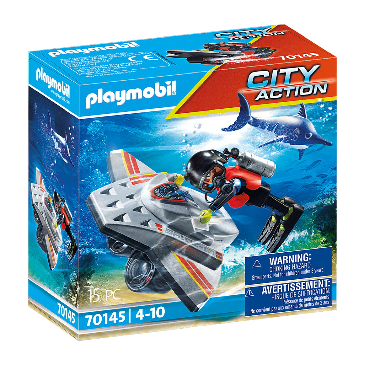 Un set scatola Playmobil di un subacqueo con una moto d'acqua e uno squalo. Il subacqueo ha un casco nero e una bombola di ossigeno.