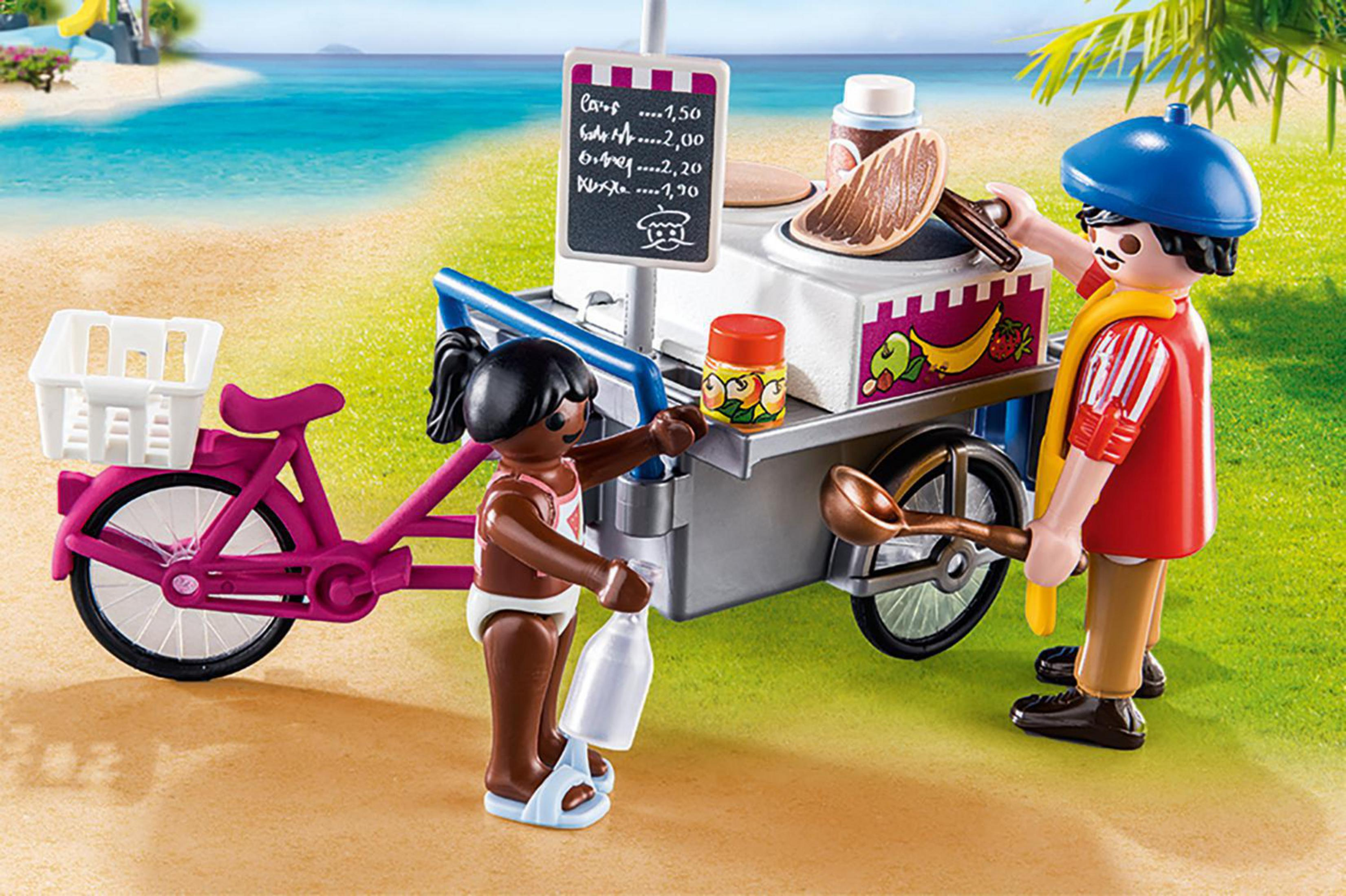 Stoisko z lodami Playmobil z figurkami, różowym rowerem i sceną na plaży.