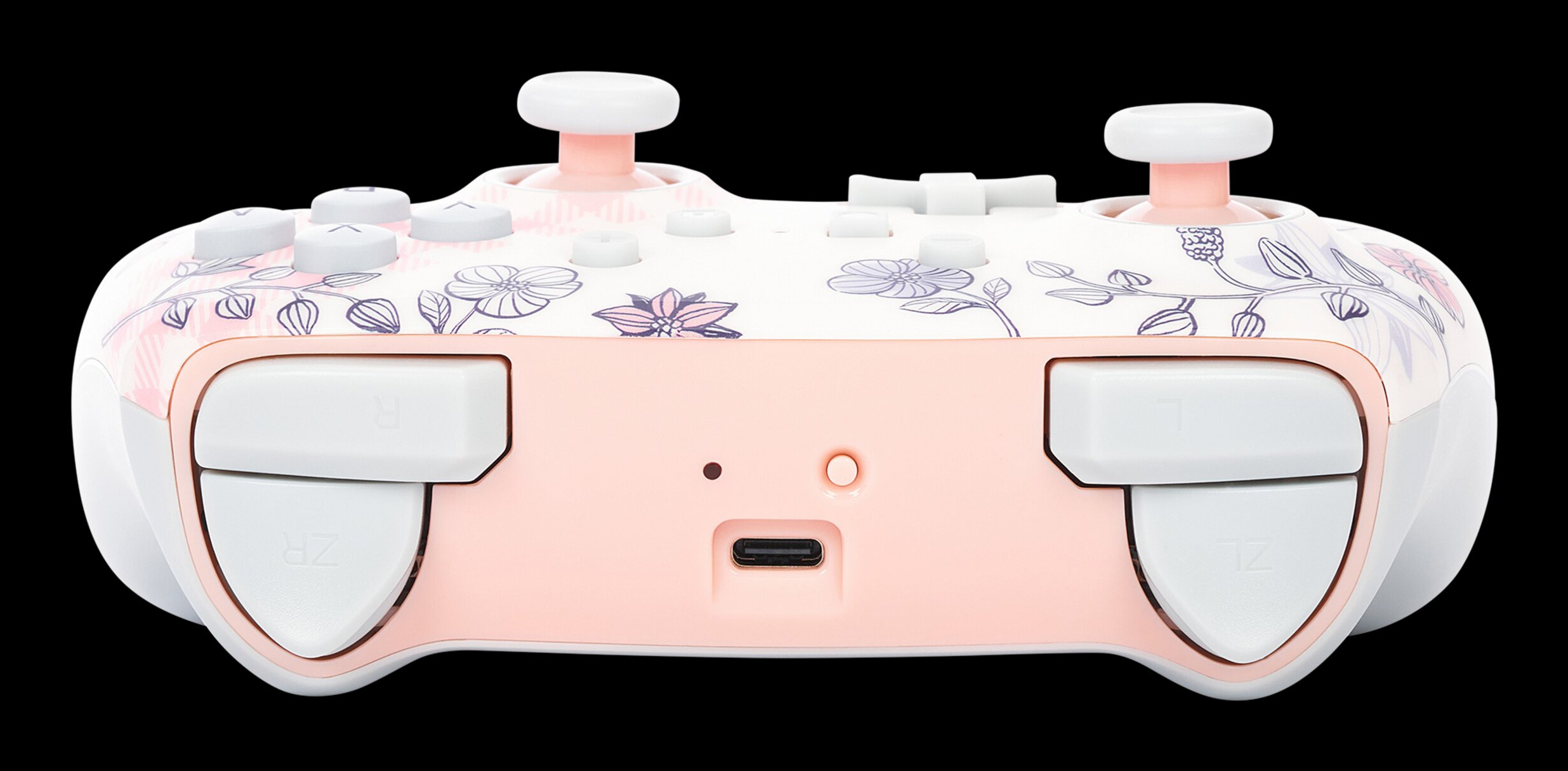 Kontroler do gier z kwiatowym wzorem do konsoli, z białymi przyciskami i różową obudową.