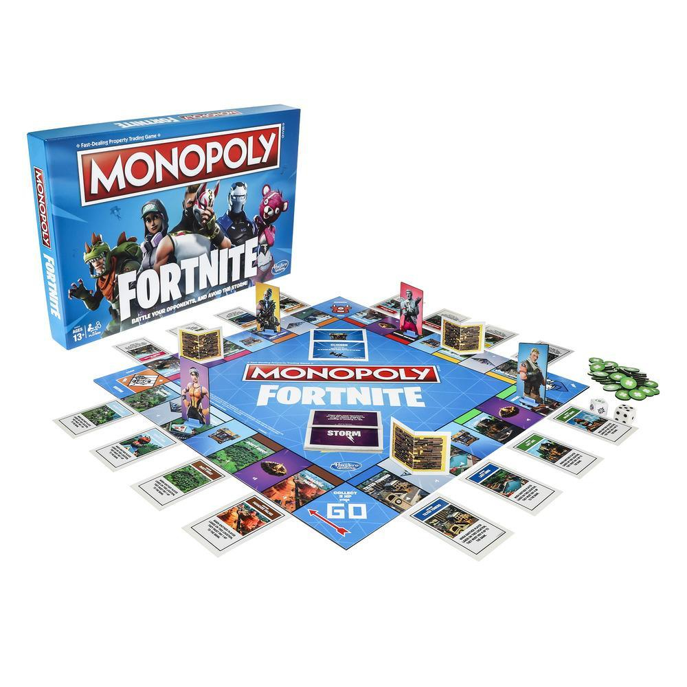 Monopoly Fortnite Brettspiel mit Spielsteinen und Würfeln auf weißer Oberfläche.