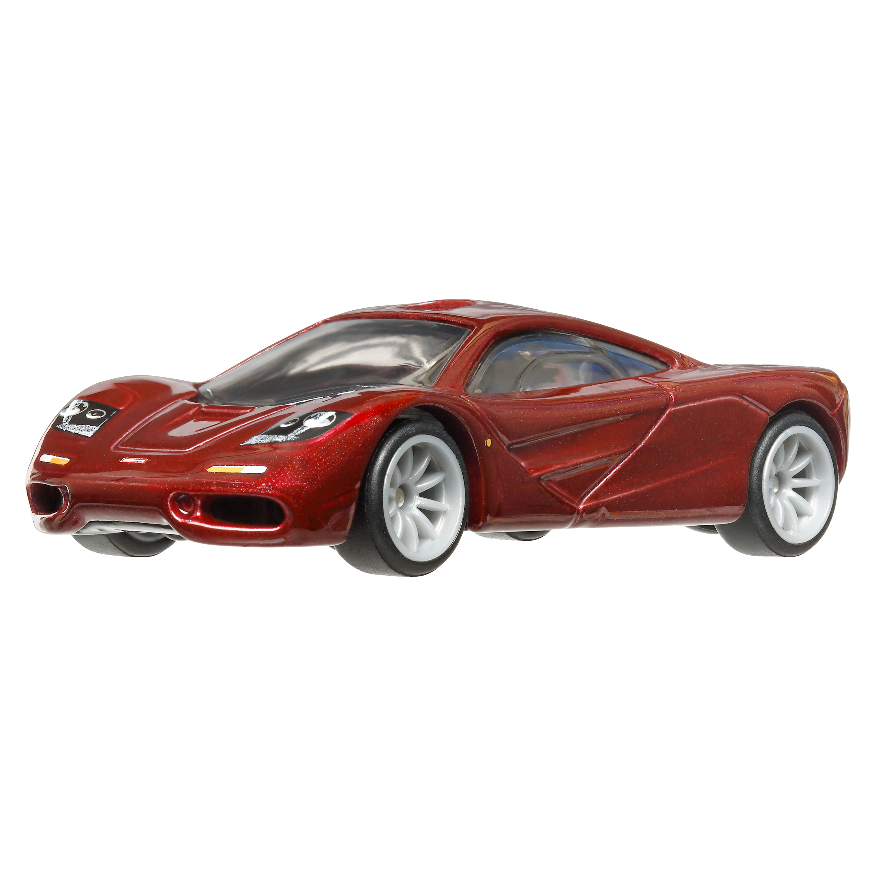 Ein rotes Spielzeugauto, ein McLaren F1, wird gezeigt.