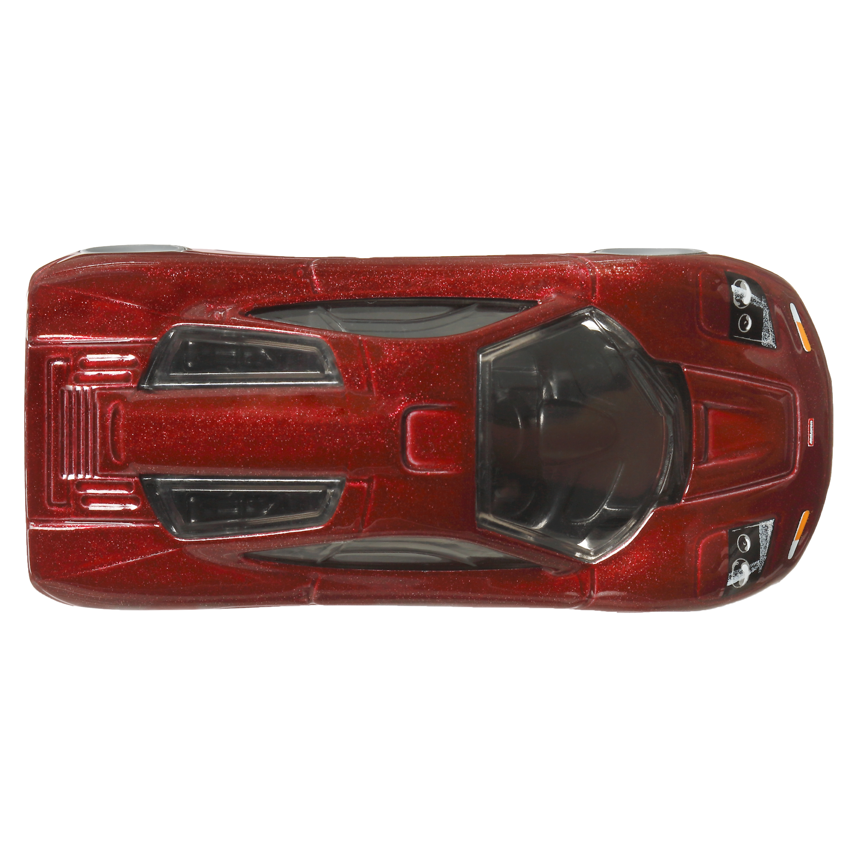 Draufsicht auf ein rotes, glitzerndes McLaren F1 Spielzeugauto, auf weißem Hintergrund.