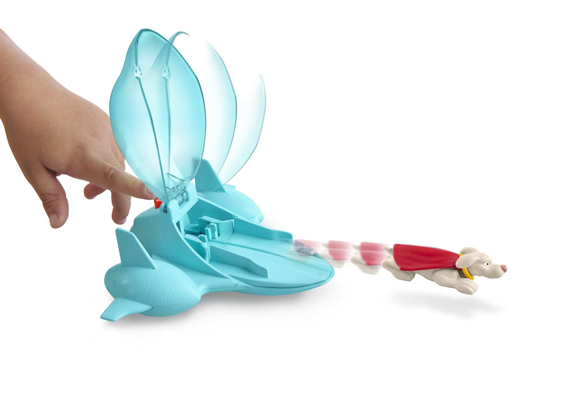 Ręka wypychająca zabawkę psa z czerwoną peleryną z niebieskiego statku kosmicznego.