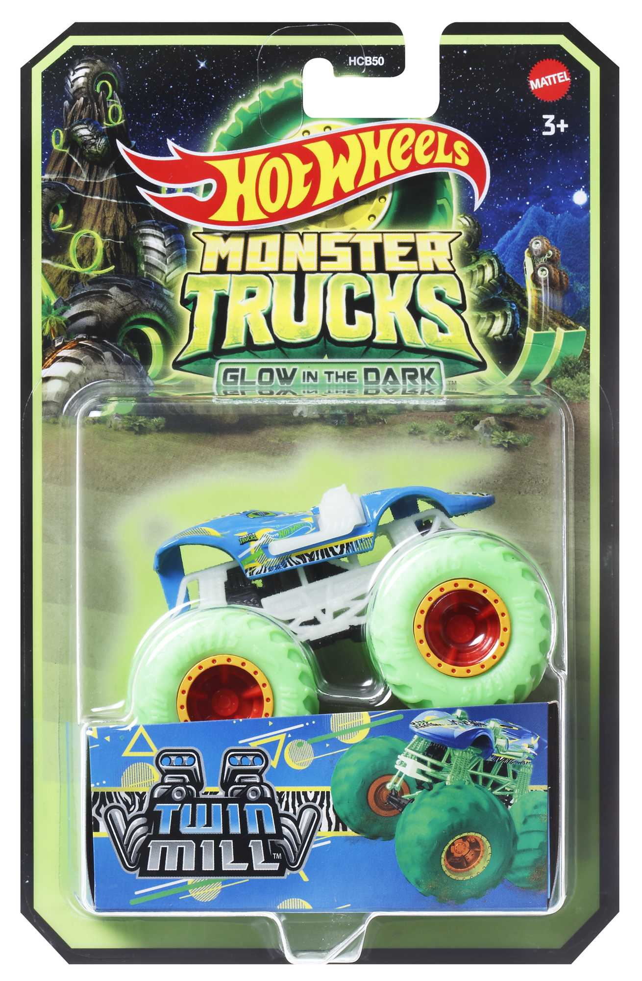 Hot Wheels monster truck w pudełku. Niebieska ciężarówka z zielonymi kołami, świeci w ciemności.