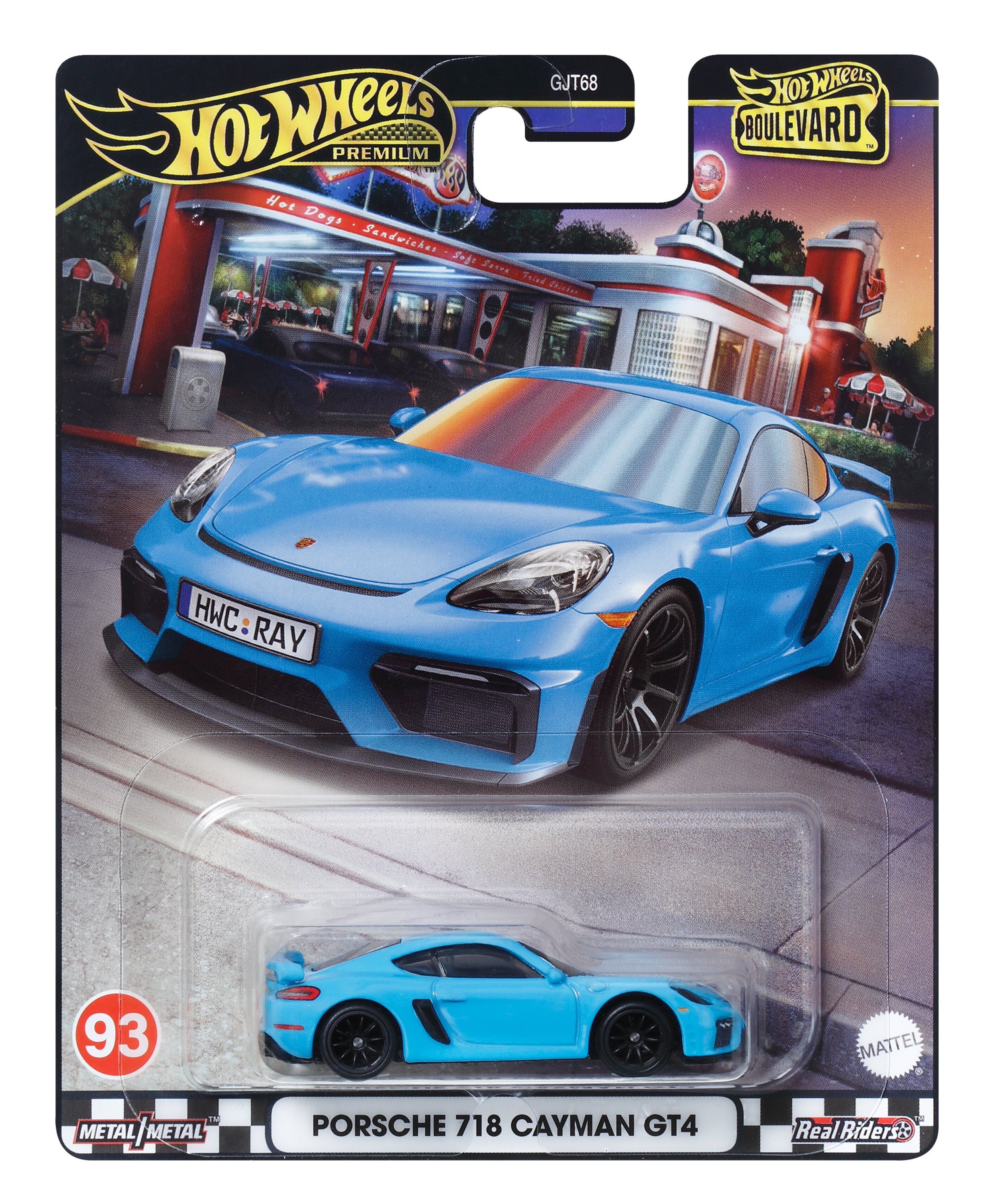 Niebieski zabawkowy samochód z czarnymi kołami w opakowaniu, z tłem restauracji szybkiej obsługi.