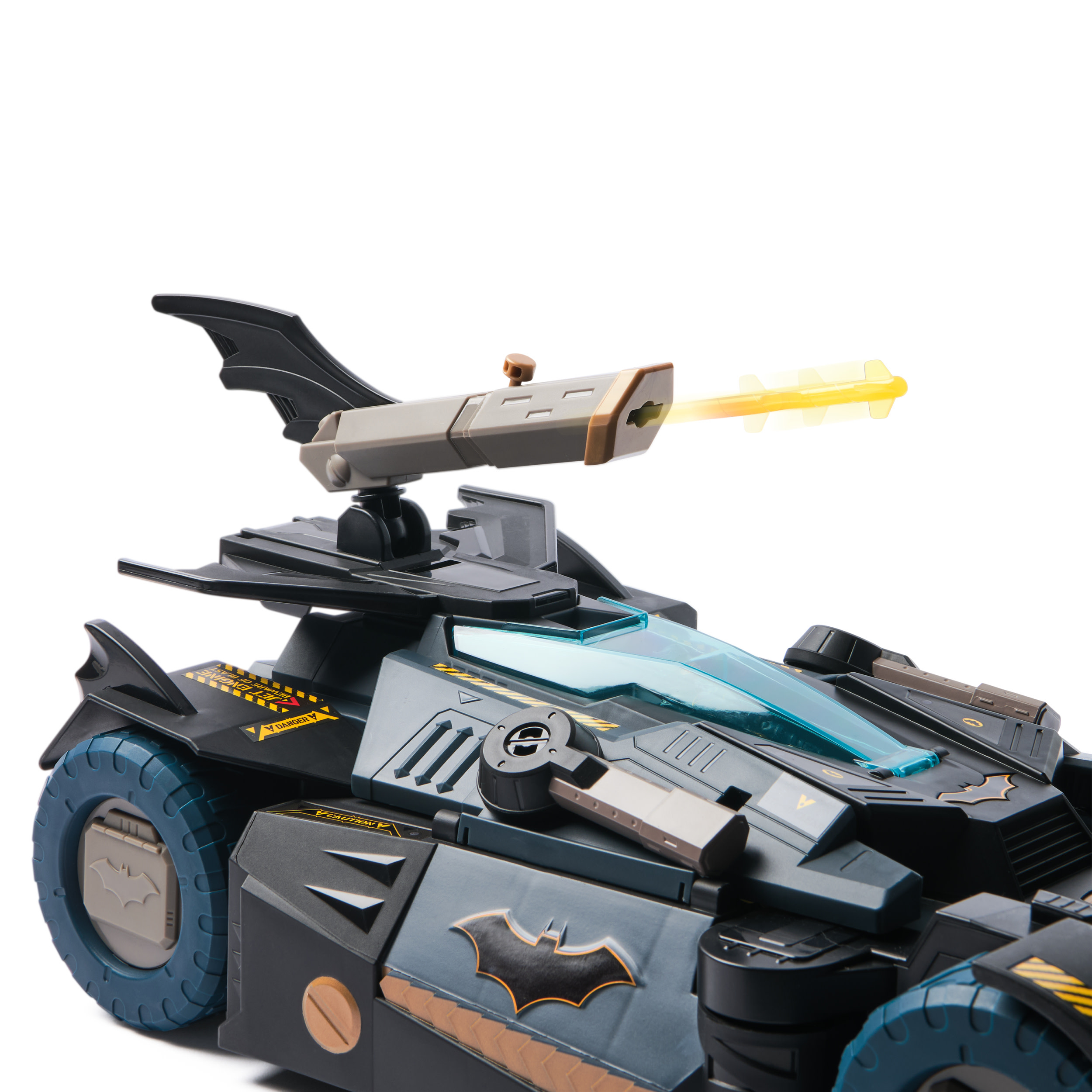 Coche de juguete de Batman. El coche es negro y gris con un símbolo de murciélago. Tiene un arma.