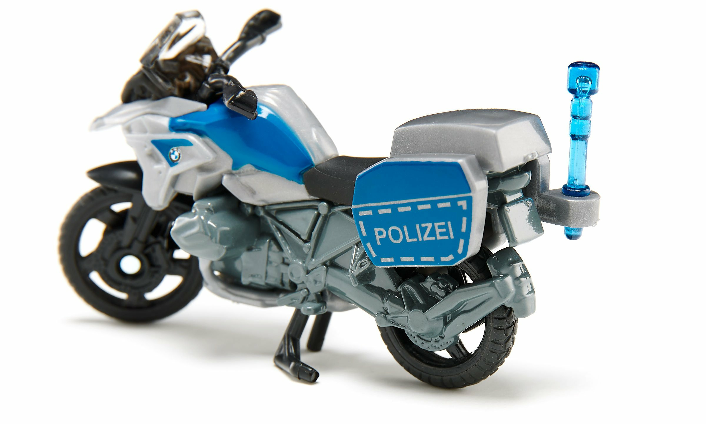 Motocicletta della polizia giocattolo. Colori bianco, blu e grigio. Etichetta POLIZEI sul lato.