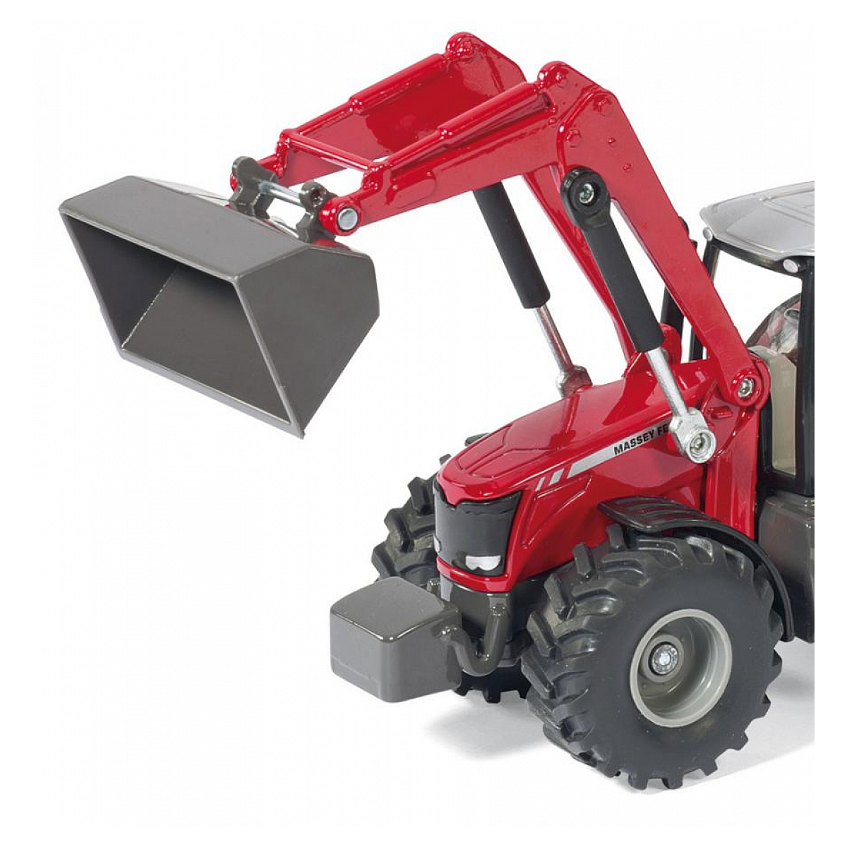 Czerwony traktor zabawka z ładowaczem czołowym. Białe tło.