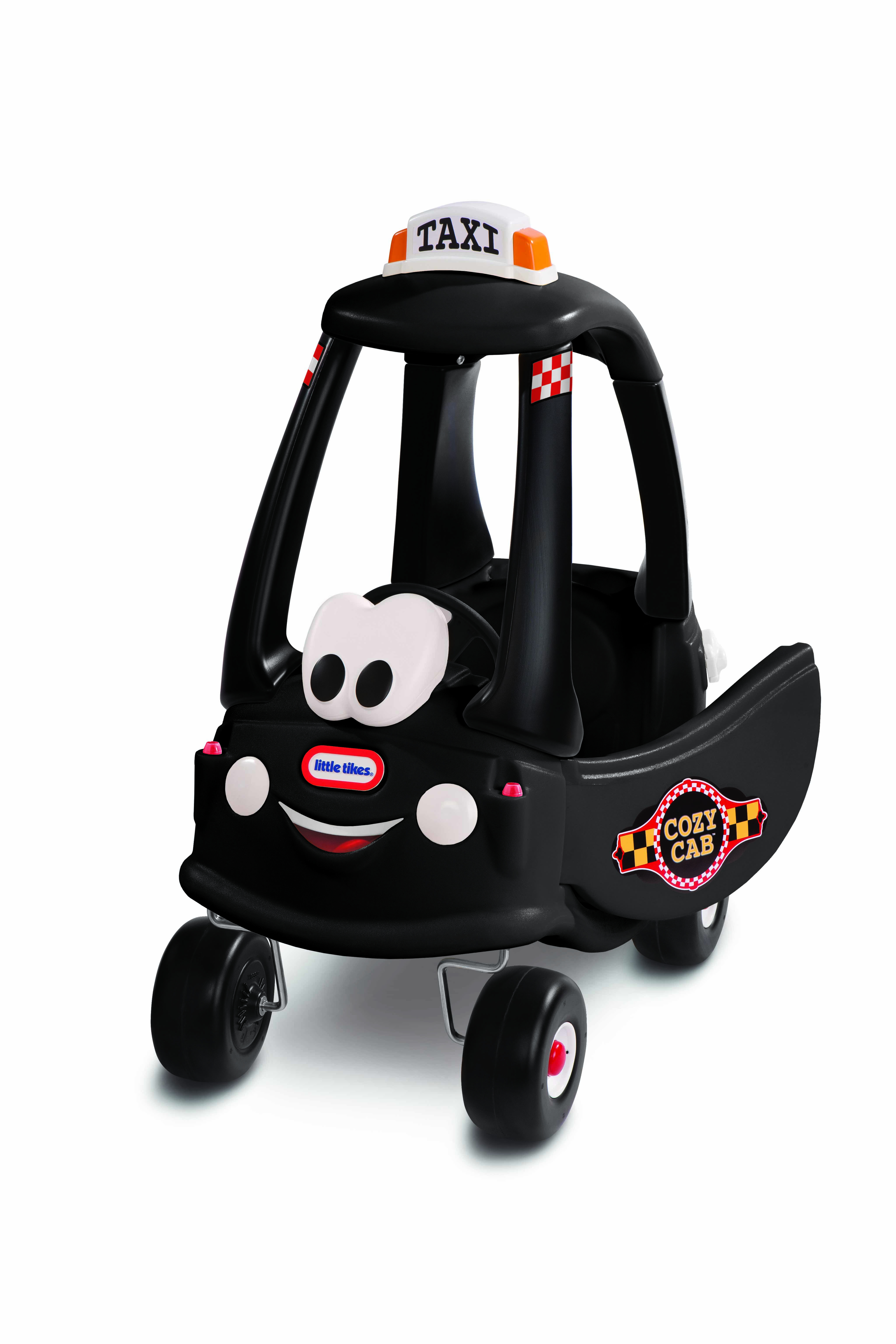 Un'auto giocattolo Cozy Coupe taxi nera con un volto sorridente, su sfondo bianco.