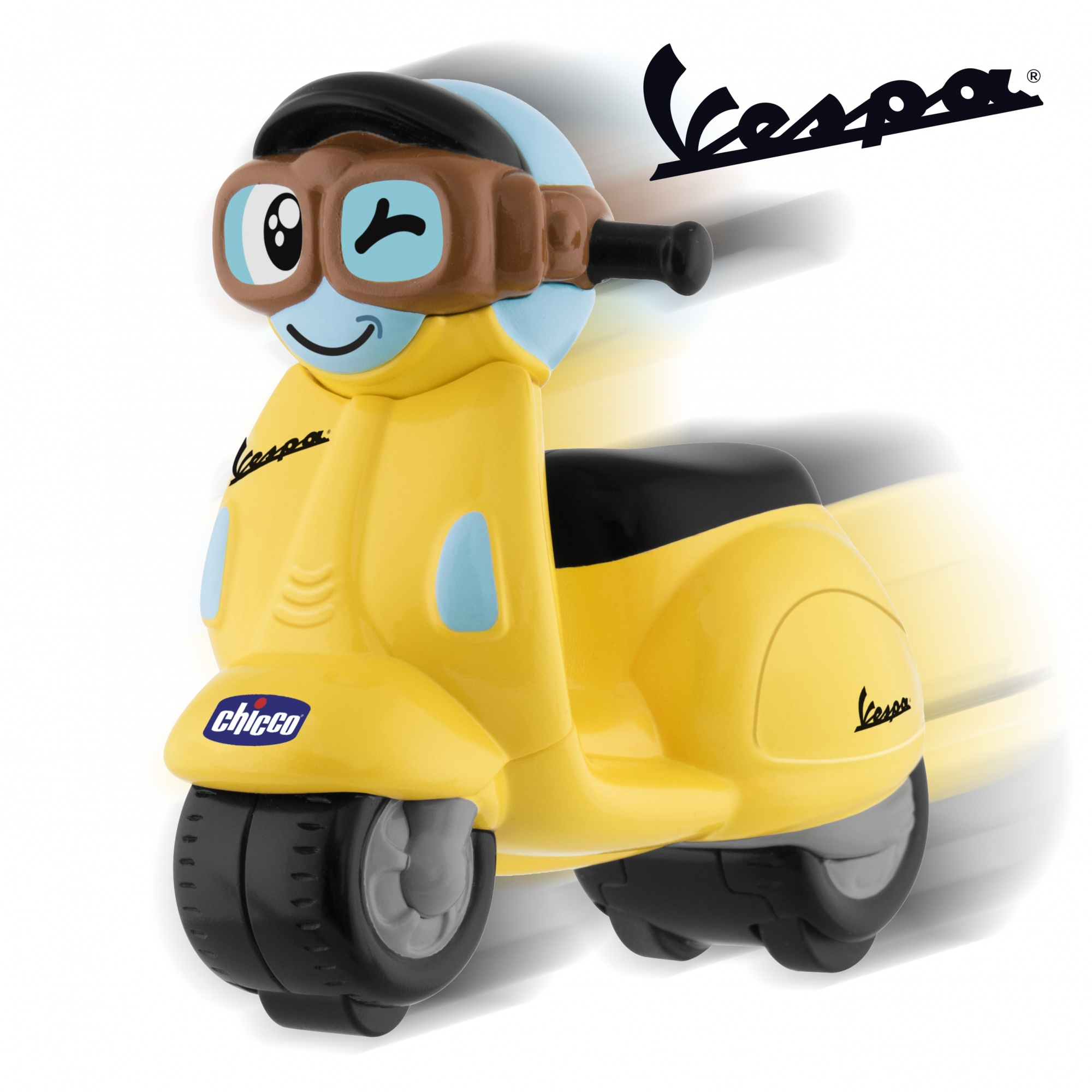 Żółty skuter zabawkowy Vespa z uśmiechniętą twarzą i czarnym kaskiem. Ma logo Vespa.