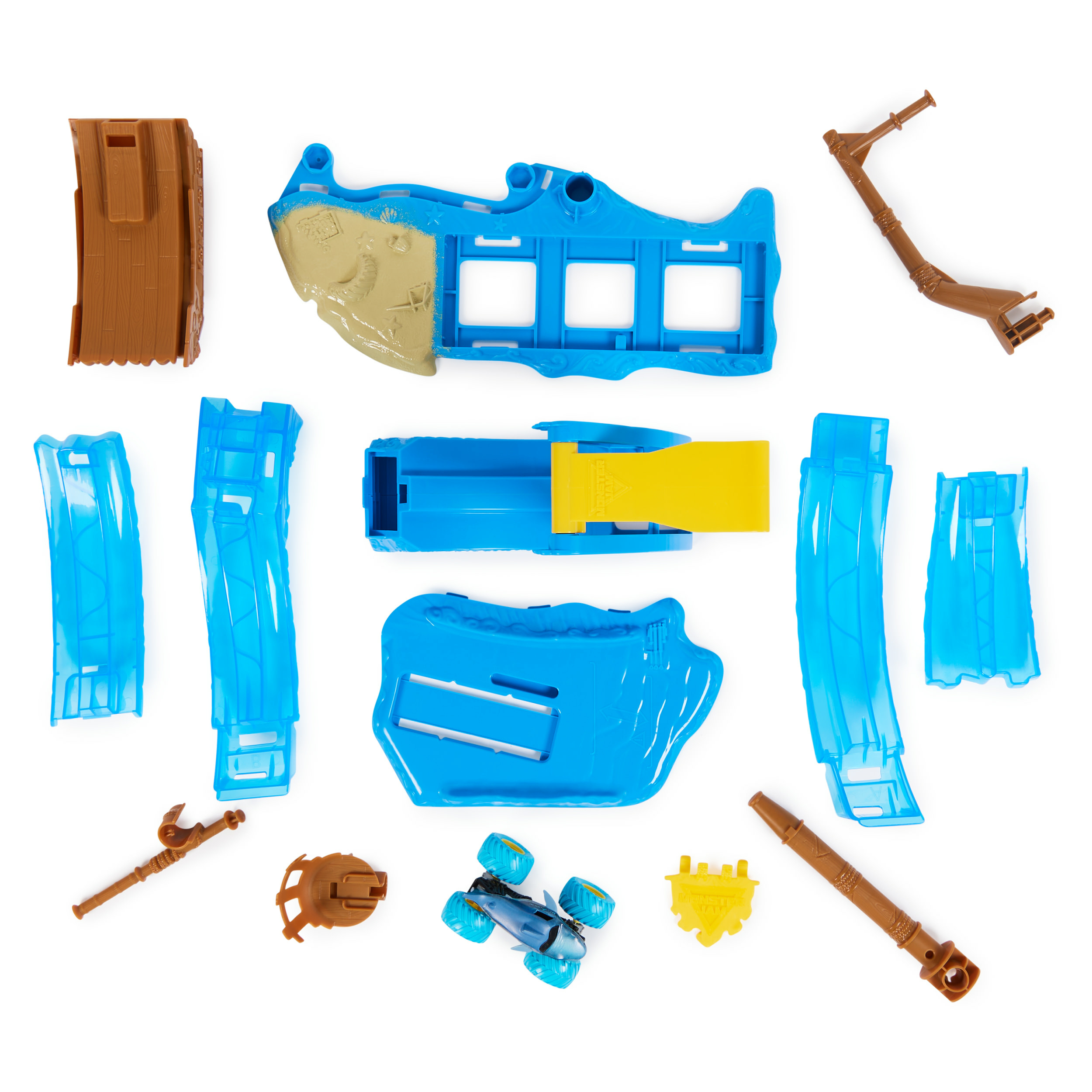 Różne niebieskie i brązowe części zabawek, w tym statek, rampy i zabawka ciężarówki potwora.