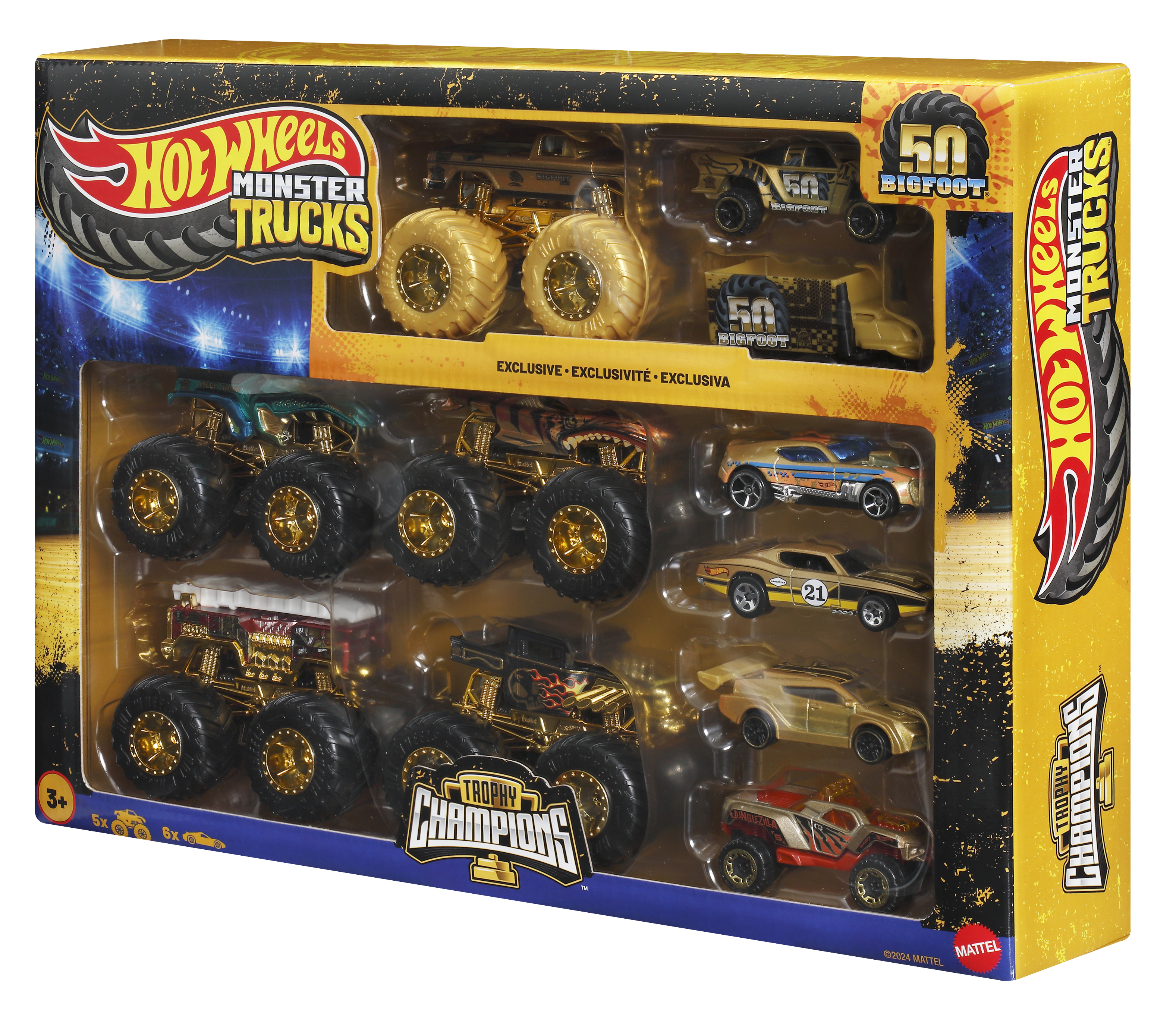 Hot Wheels Monster Trucks Set mit goldenen und anderen farbigen Monstertrucks in der Verpackung.
