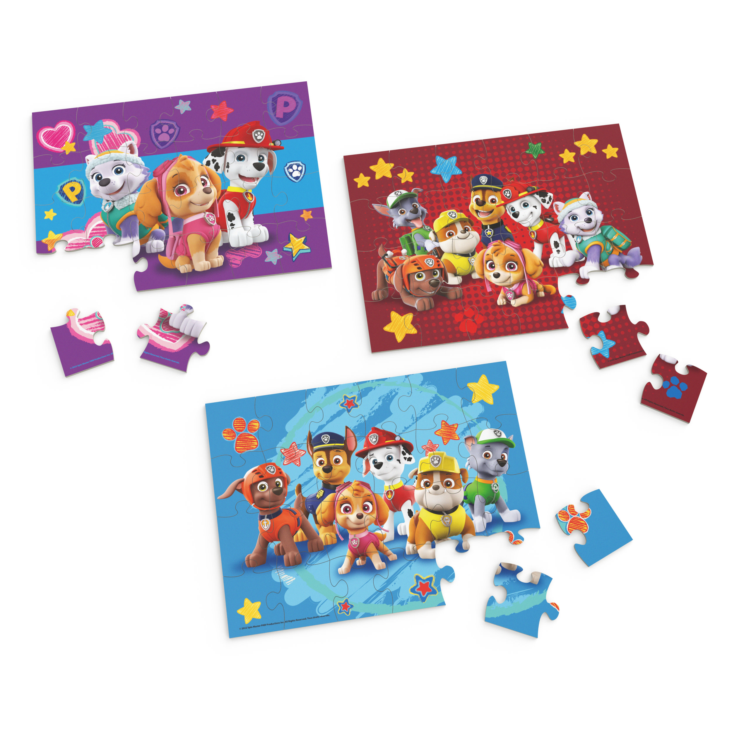 Trzy puzzle Paw Patrol ze szczeniakami. Każdy ma inną scenę i postacie.
