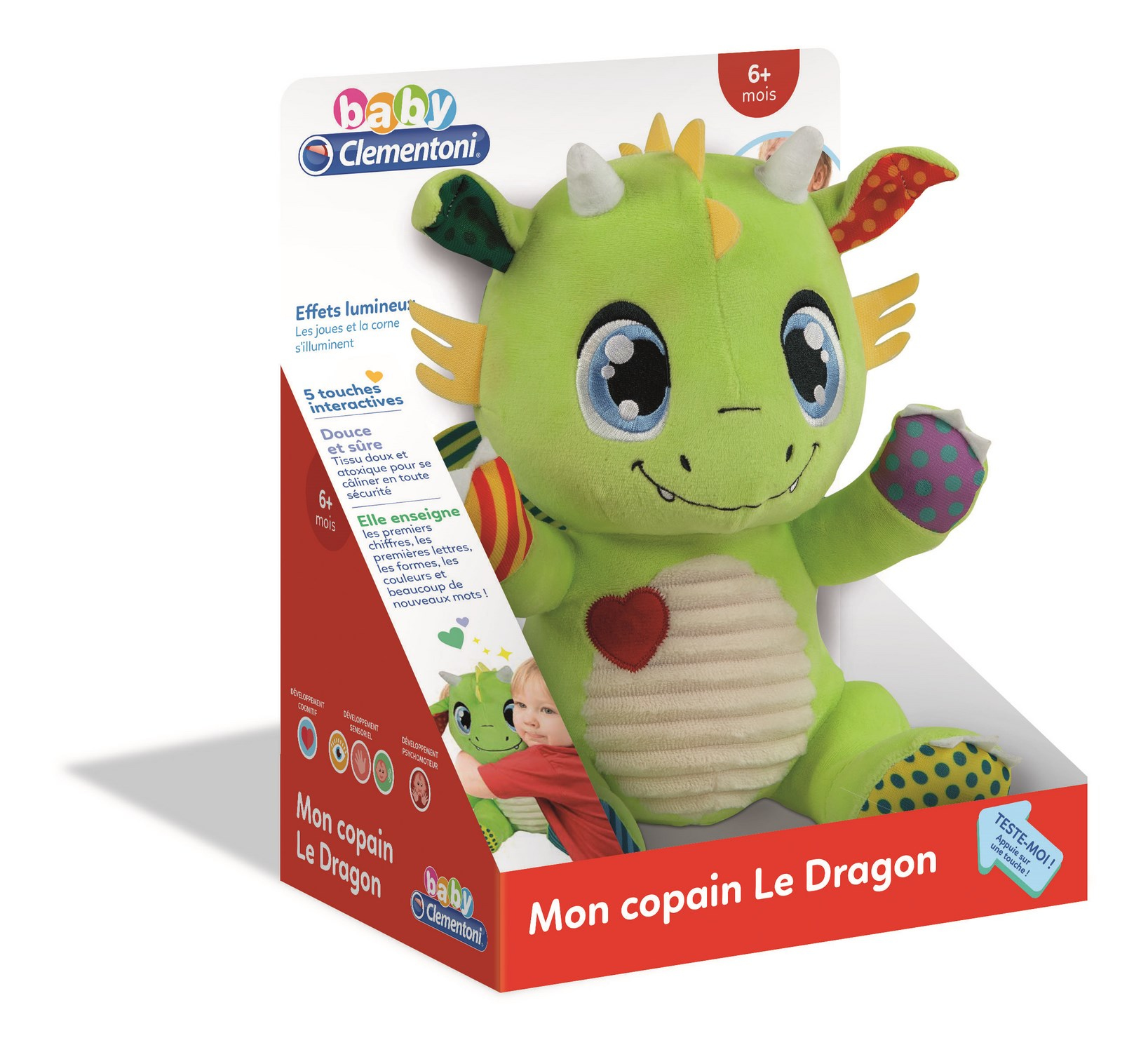 Zielona pluszowa zabawka smoka w pudełku. Tekst po francusku. Białe tło.