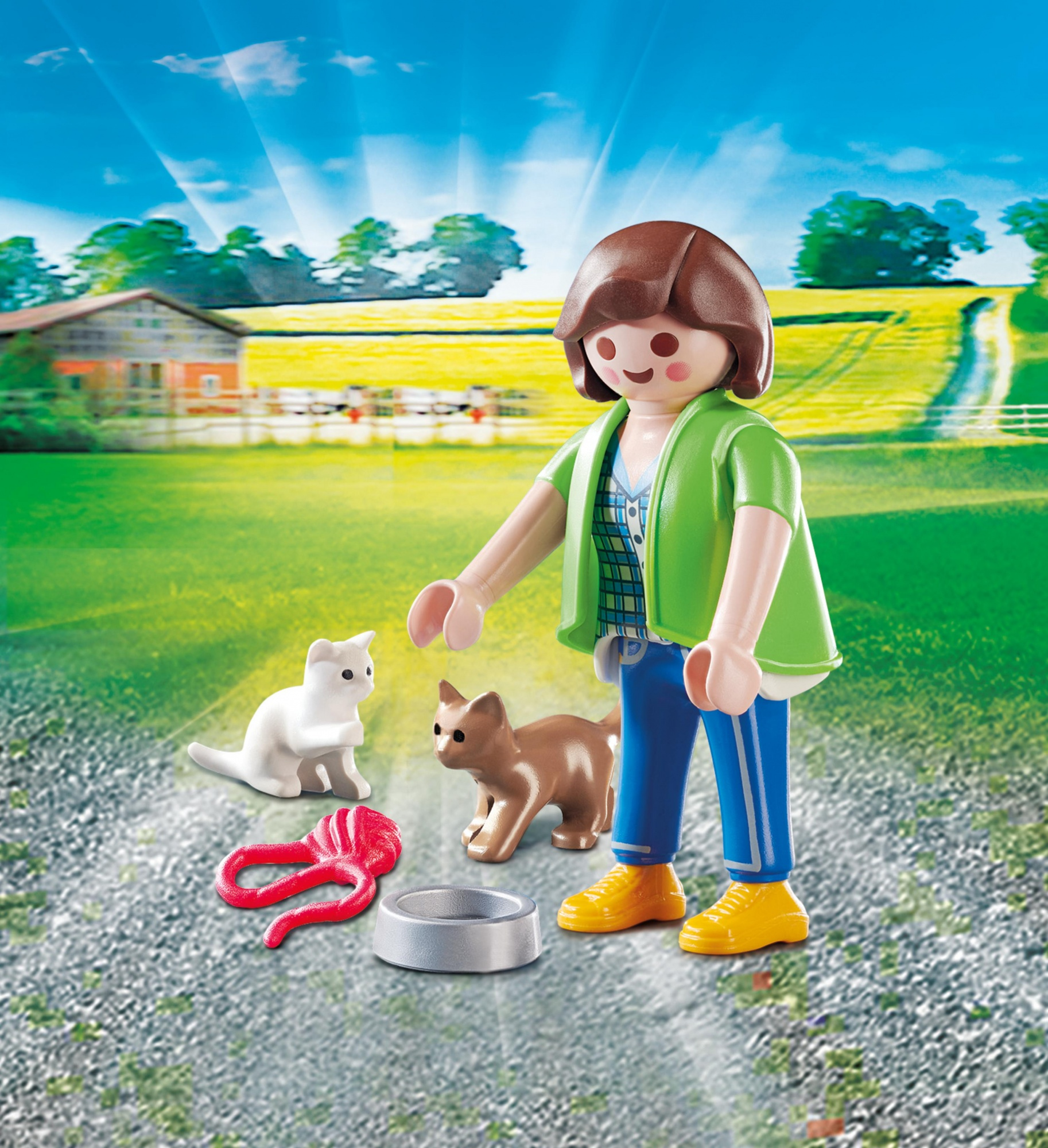 Figurka Playmobil z dwoma kotami. Scena rozgrywa się na zewnątrz z farmą i zieloną trawą.