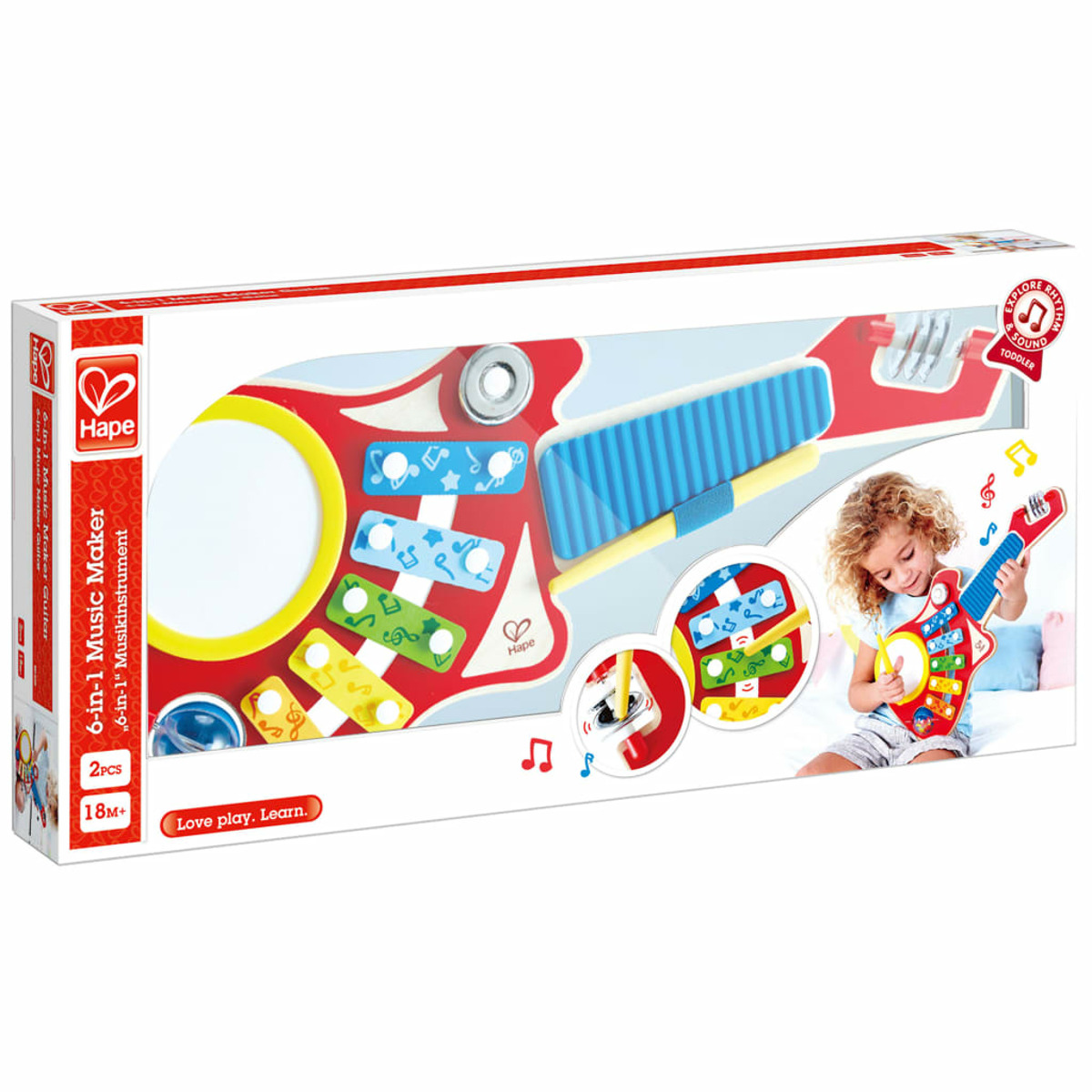 Ein Musikspielzeug in einer Schachtel, mit einem Mädchen, das eine Gitarre hält. Weißer Hintergrund.