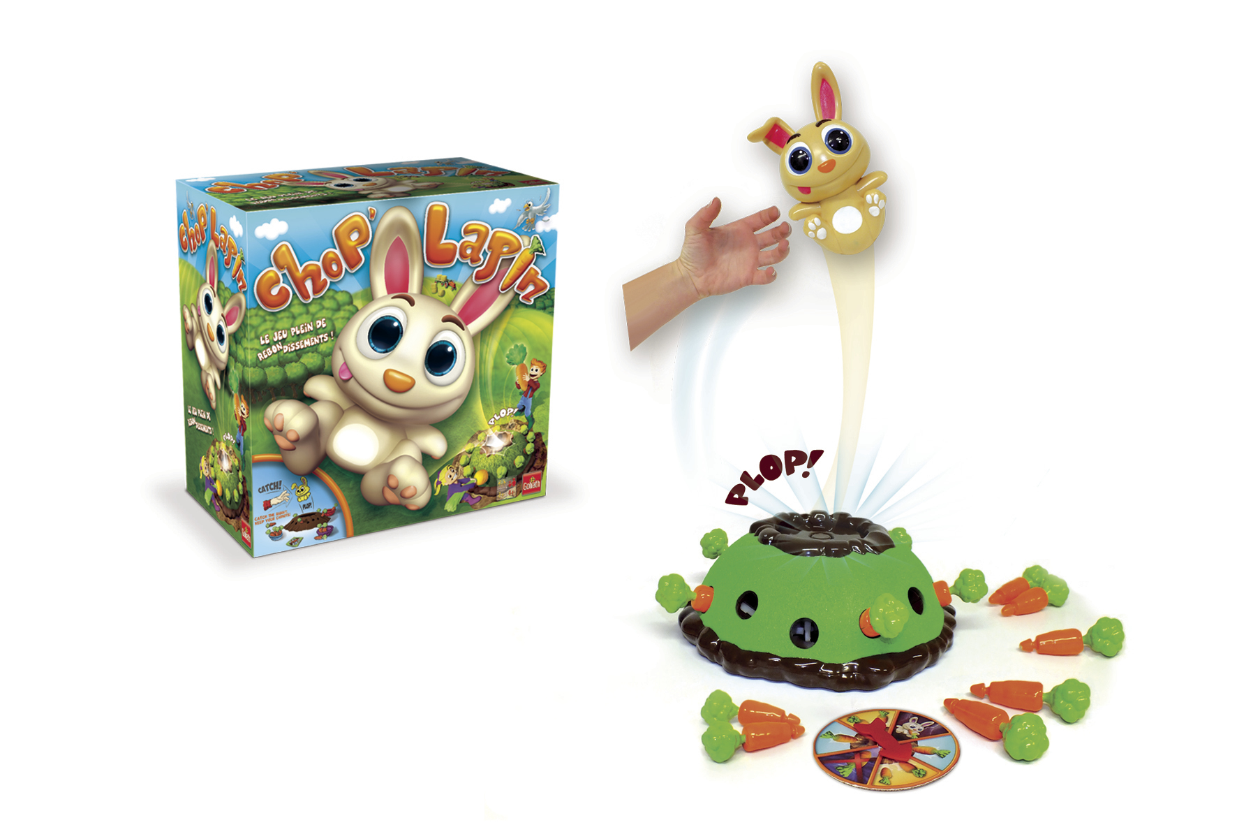 Scatola di gioco giocattolo e una scena di gioco. Un coniglietto giocattolo esce dal terreno con carote.